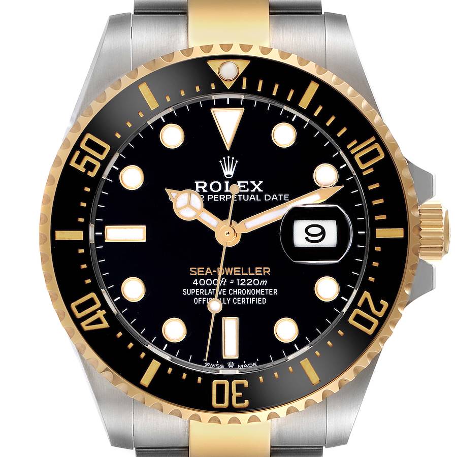 The image shows a front view of the Rolex Sea-Dweller watch, highlighting the dial, bezel, and part of the bracelet.