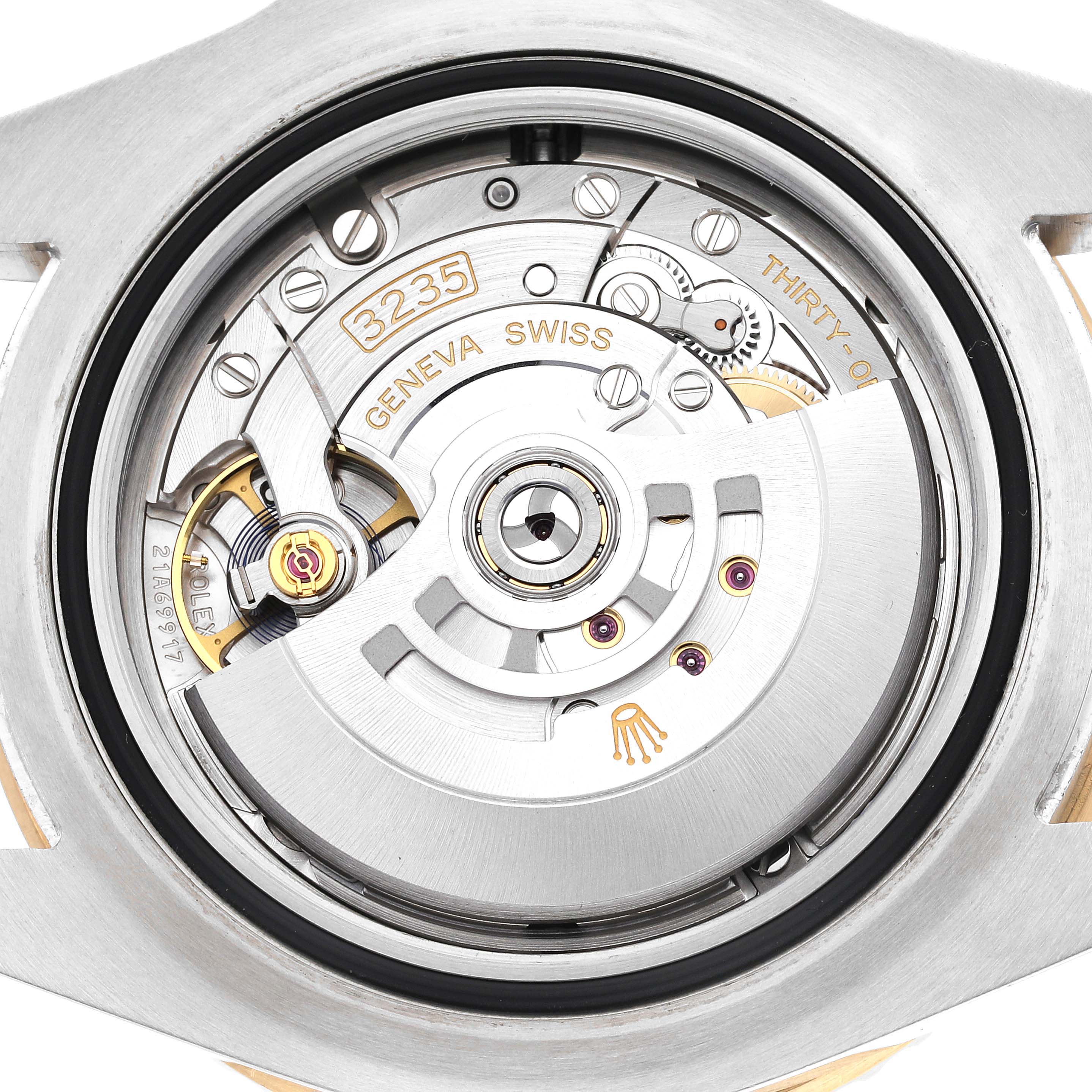 The image shows a close-up of the back movement of a Rolex Sea-Dweller 126603 Men
s Steel and Gold (two tone) Black Dial 126603 Men
s Steel and Gold (two tone) Black Dial watch, highlighting its intricate mechanical parts.