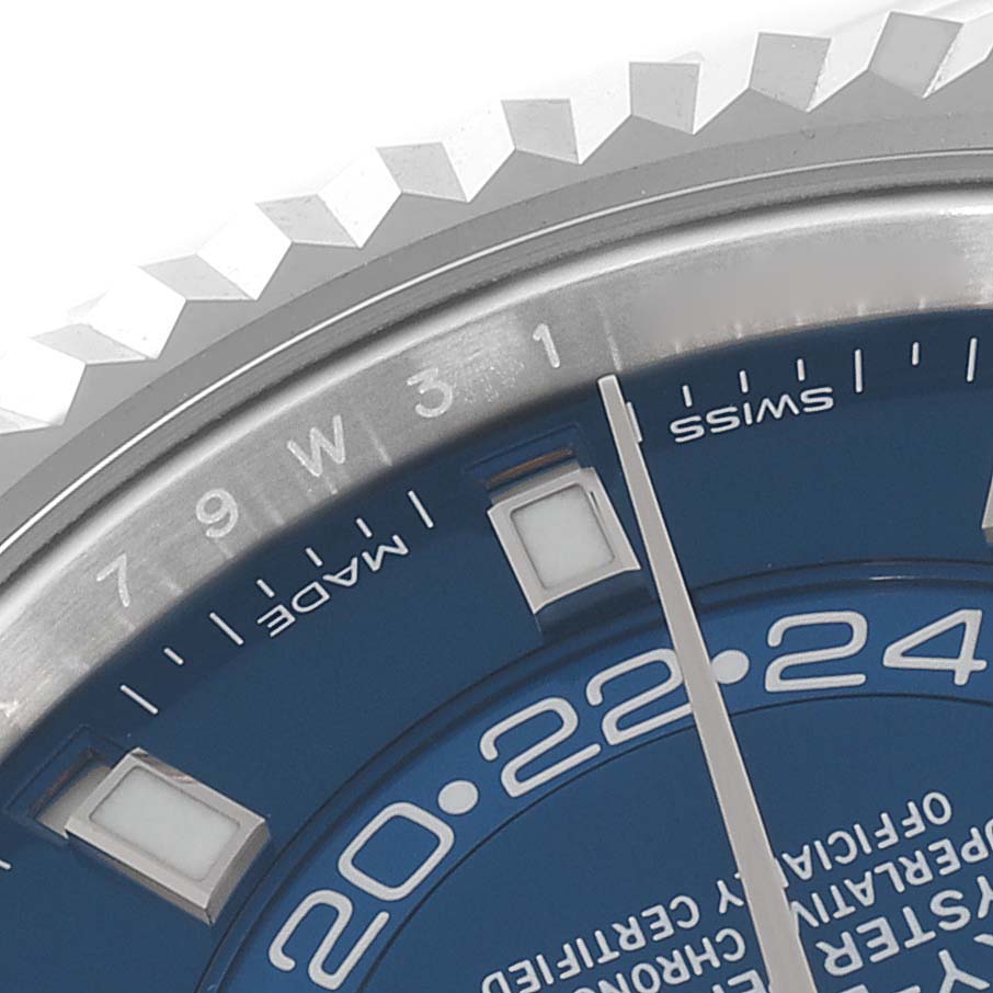 The image shows a close-up of the dial and bezel of a Rolex Sky-Dweller 326934 Men's Stainless Steel Blue Dial 326934 Men's Stainless Steel Blue Dial watch, focusing on the month indicator and part of the blue watch face.