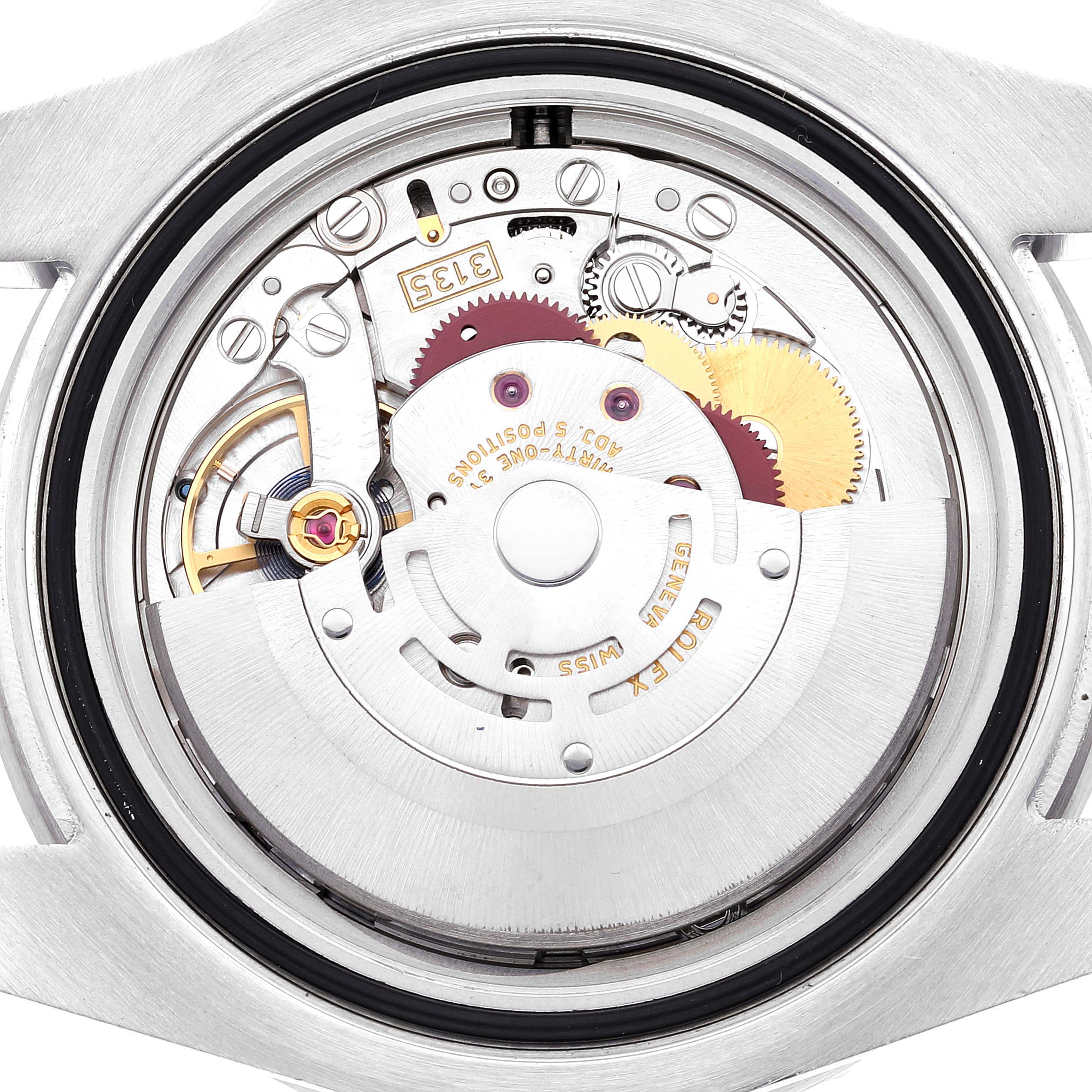 This is an interior view of the Rolex Submariner 116610LV Men
s Stainless Steel Green Dial 116610LV Men
s Stainless Steel Green Dial watch, showing its intricate mechanical movement and components.