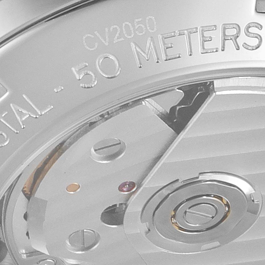 The image shows a close-up of the Tag Heuer Carrera CV2050.BD0789 Men's Steel and Gold (two tone) Silver Dial CV2050.BD0789 Men's Steel and Gold (two tone) Silver Dial watch's back, highlighting the inner mechanism and part of the outer casing.