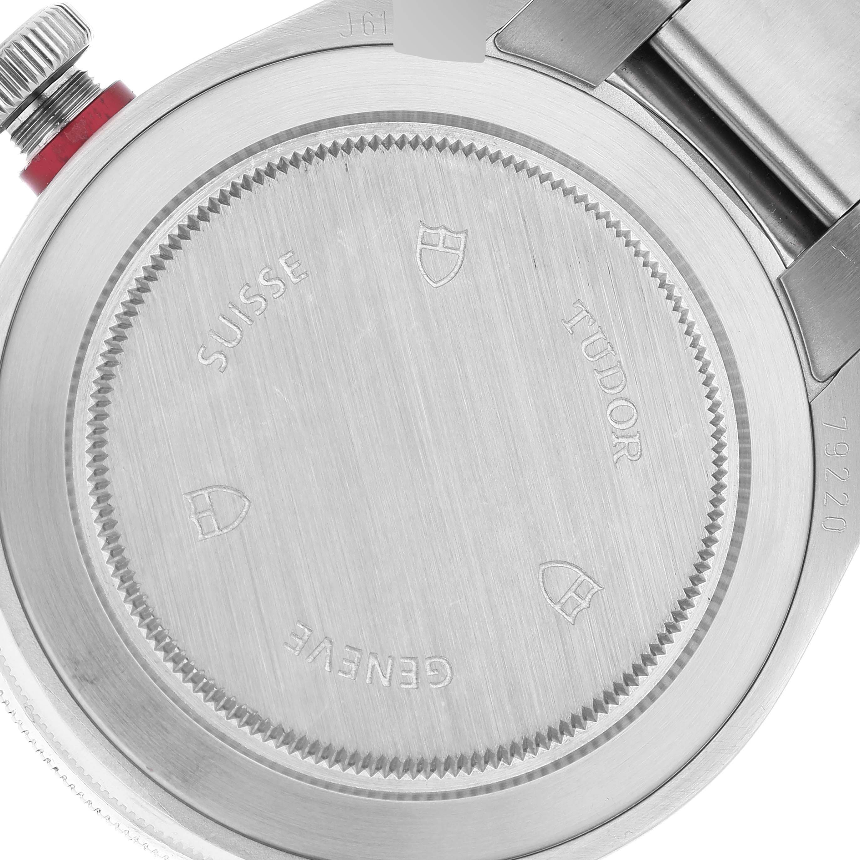 This image shows the back case of a Tudor Heritage Black Bay 79220R Men
s Stainless Steel Black Dial 79220R Men
s Stainless Steel Black Dial watch, focusing on the engravings and part of the strap.