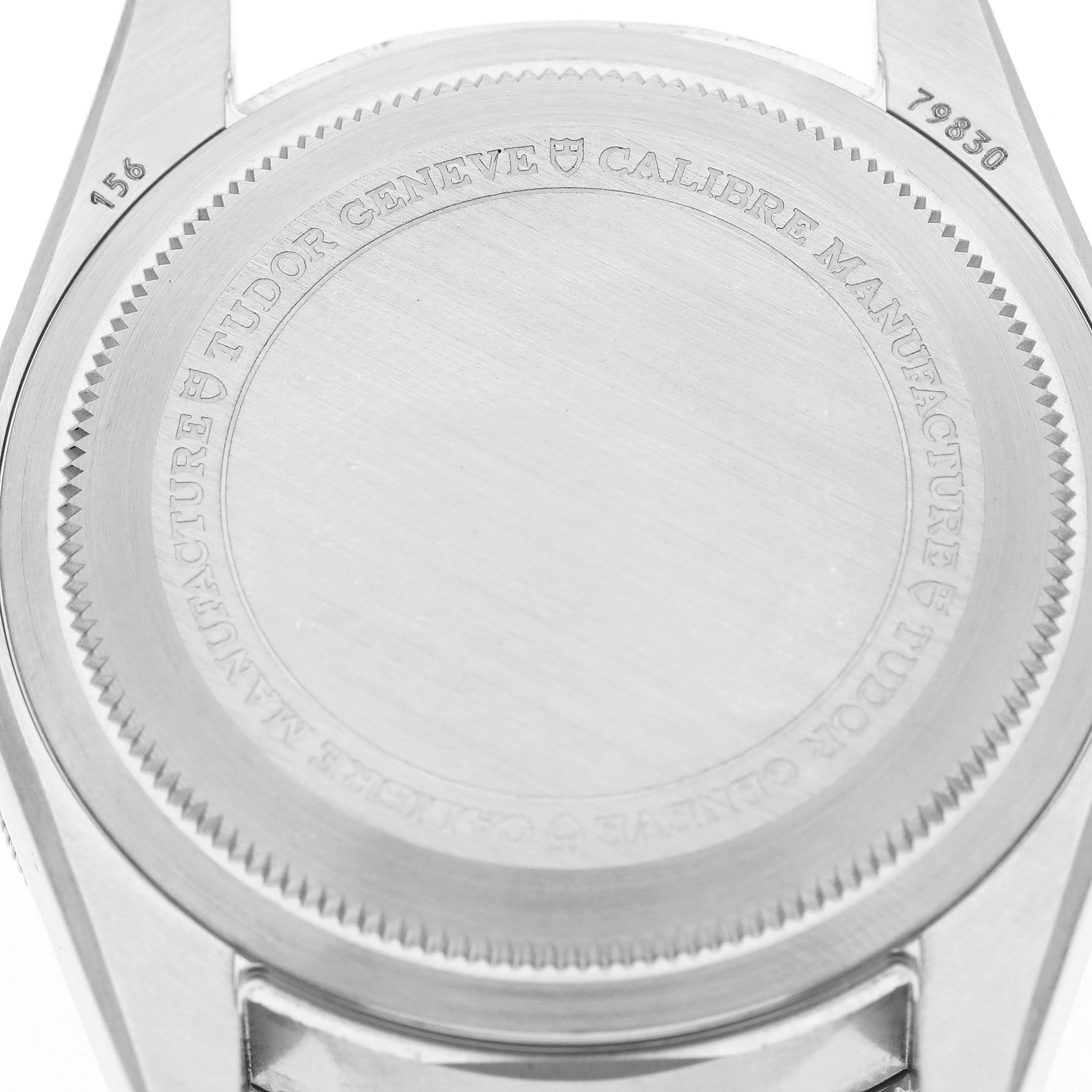 The image shows the case back of a Tudor Heritage Black Bay 79830RB Men's Stainless Steel Black Dial watch, displaying engravings and the lug area.
