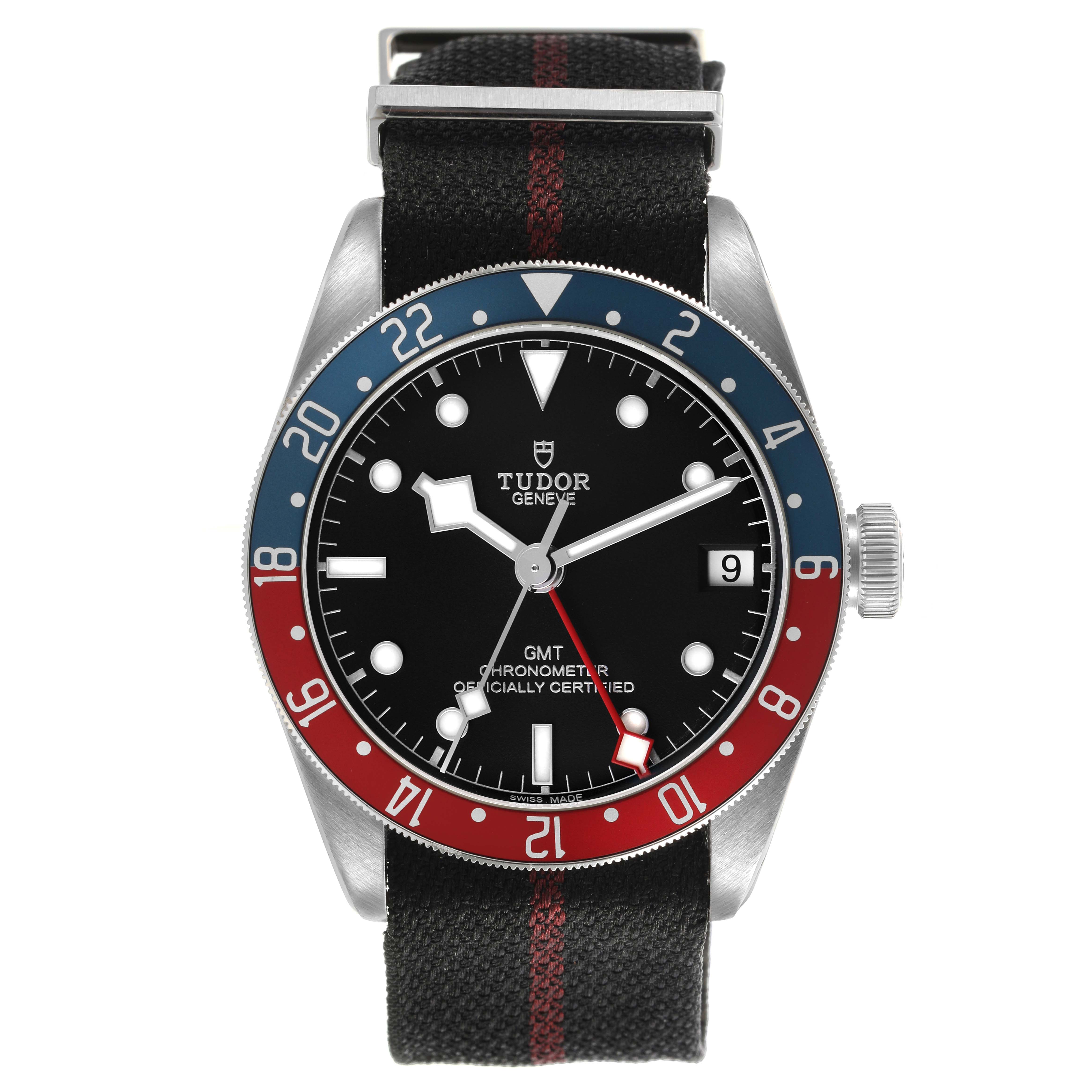 The Tudor Heritage Black Bay 79830RB Men's Stainless Steel Black Dial watch is shown from a front angle, displaying the bezel, dial, hands, and fabric strap.