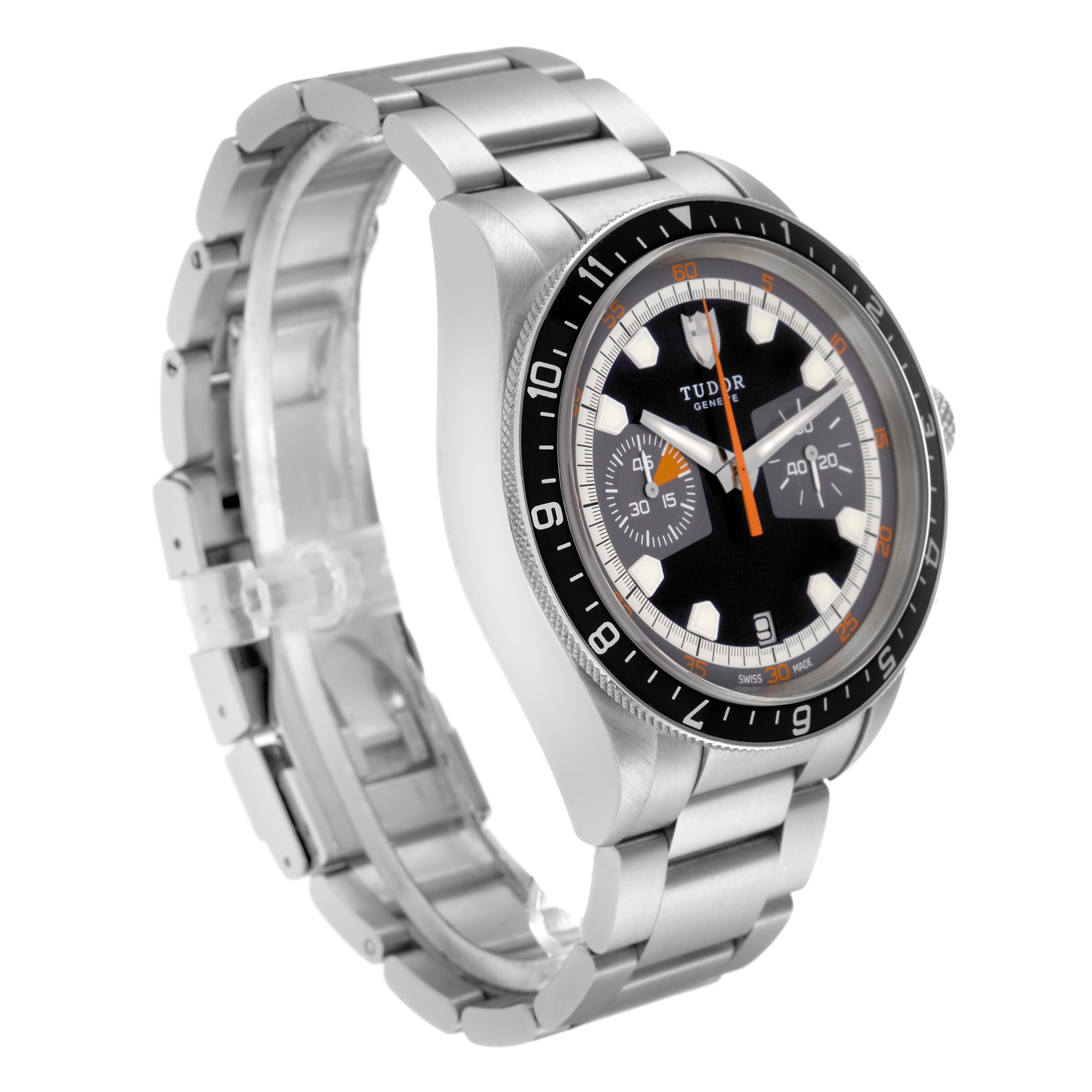 The Tudor Heritage Chrono 70330 Men's Stainless Steel Black Dial 70330 Men's Stainless Steel Black Dial watch is shown at a three-quarter angle, displaying its face, bezel, and stainless steel bracelet.