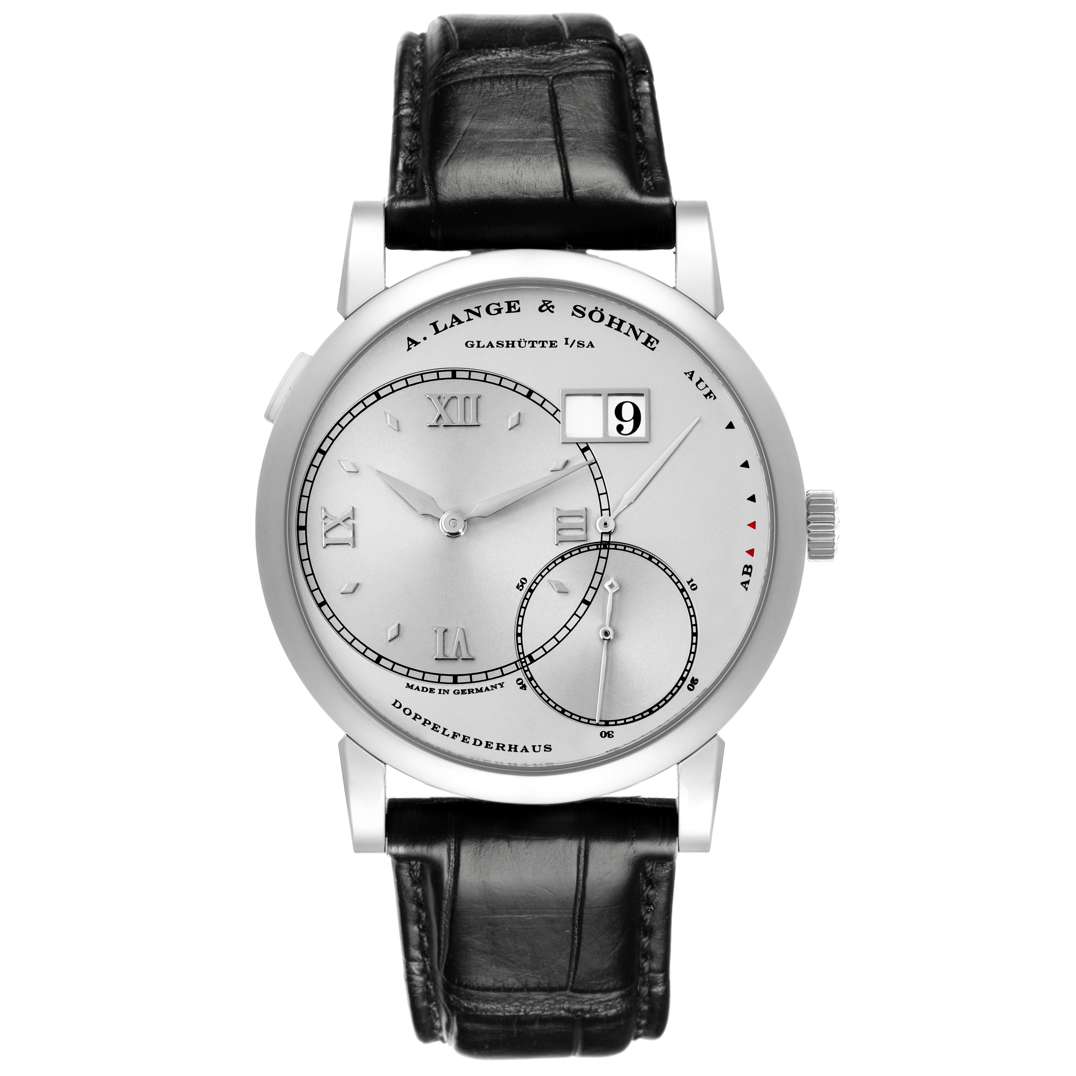 The Lange 1 watch by A. Lange & Söhne is shown from a frontal angle, displaying the dial, hands, and leather strap.