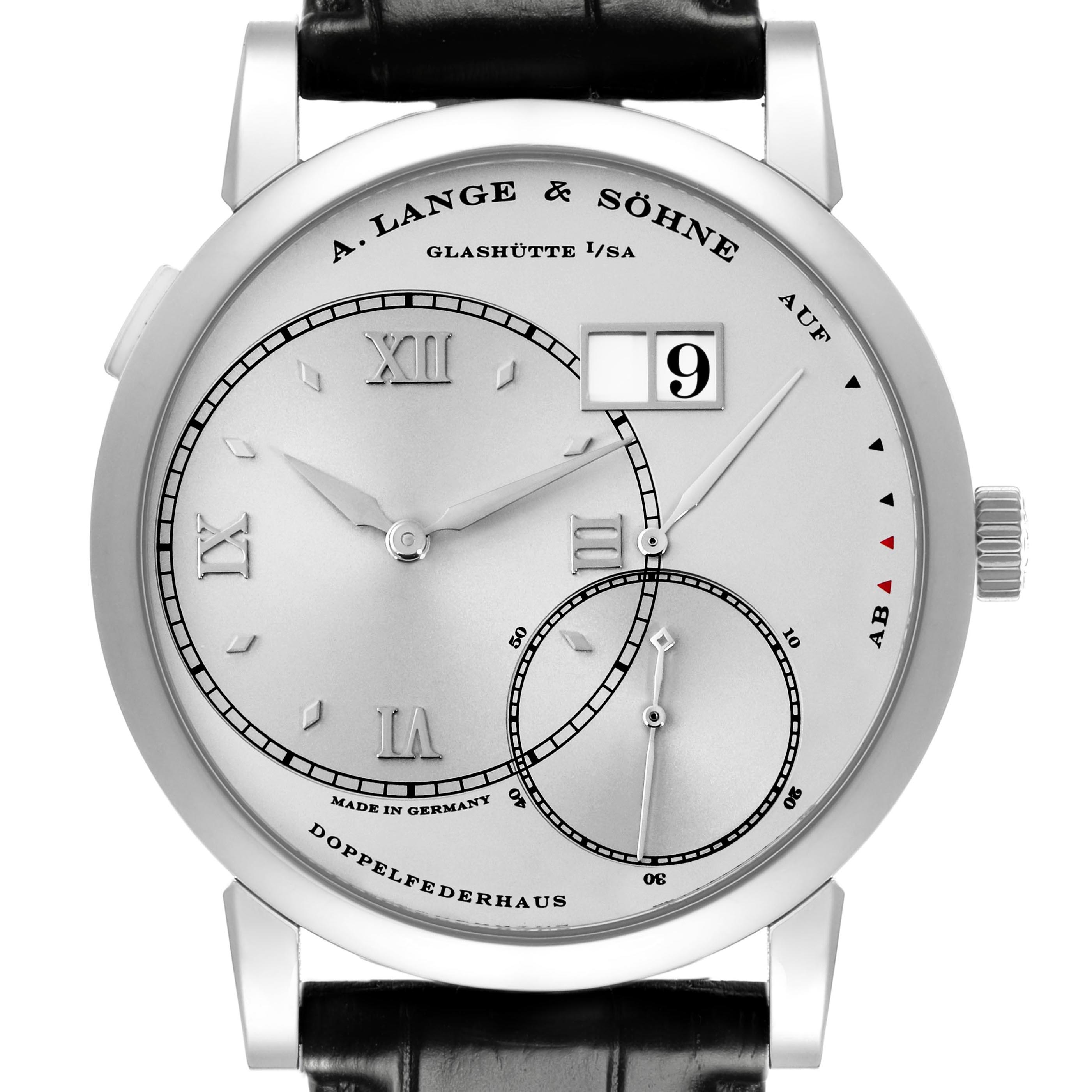 The Lange 1 by A. Lange & Söhne is shown from a front view, featuring dials, Roman numerals, and a date display.
