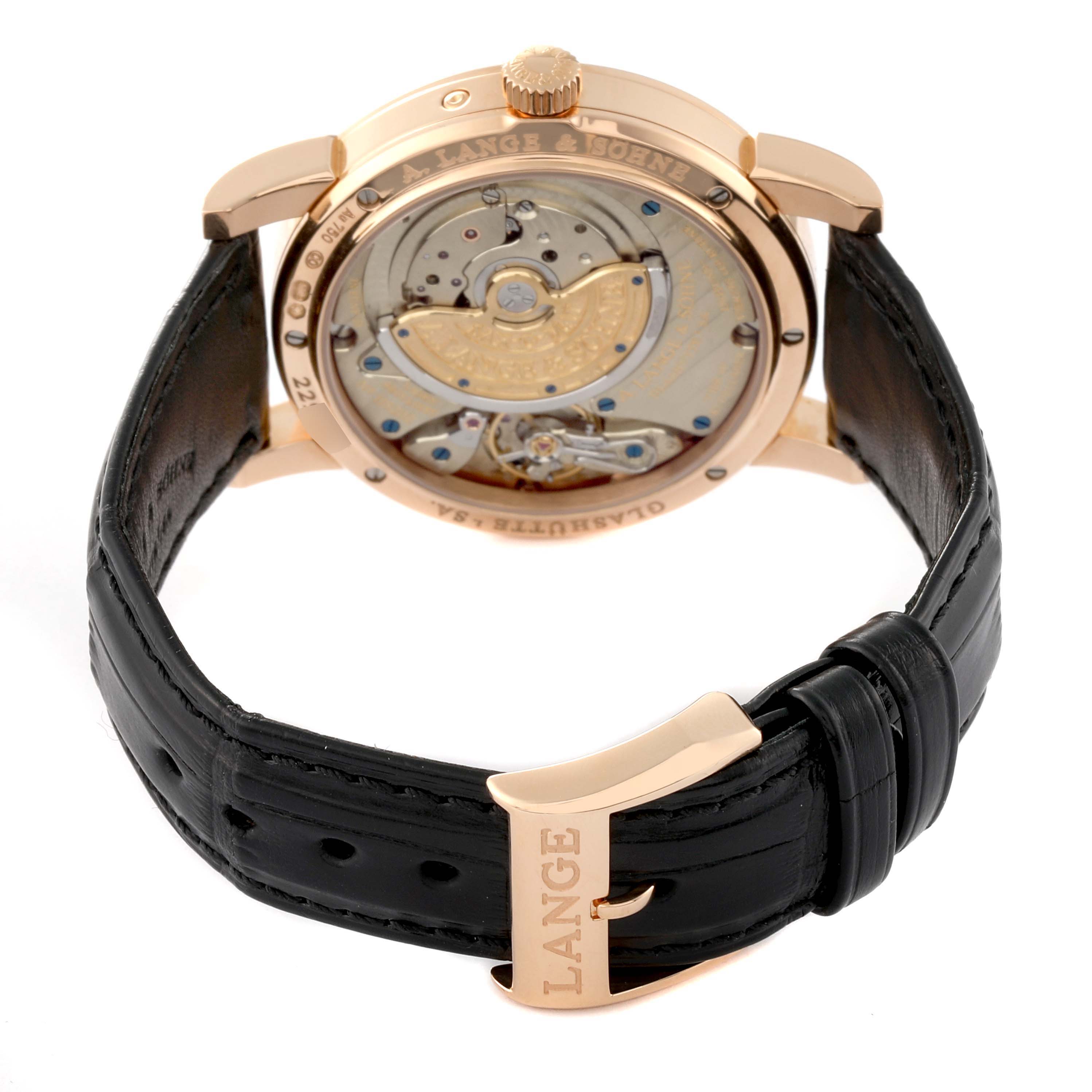 The image shows the back of a Richard Lange model by A. Lange & Söhne, displaying the movement and black leather strap with a buckle.