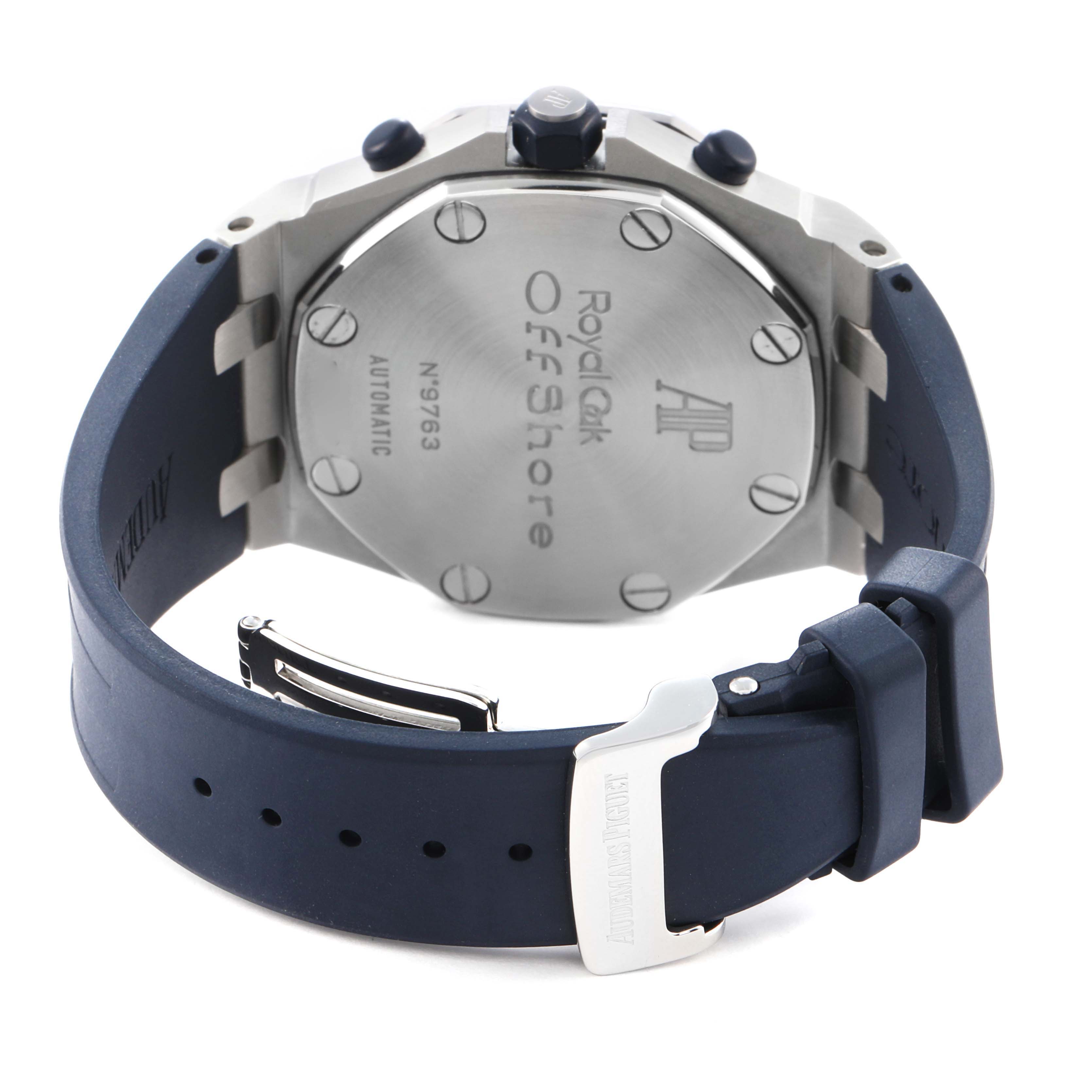 The image shows the back of an Audemars Piguet Royal Oak Offshore 26020ST Men
s Stainless Steel White Dial 26020ST Men
s Stainless Steel White Dial watch with its case back and blue strap visible.