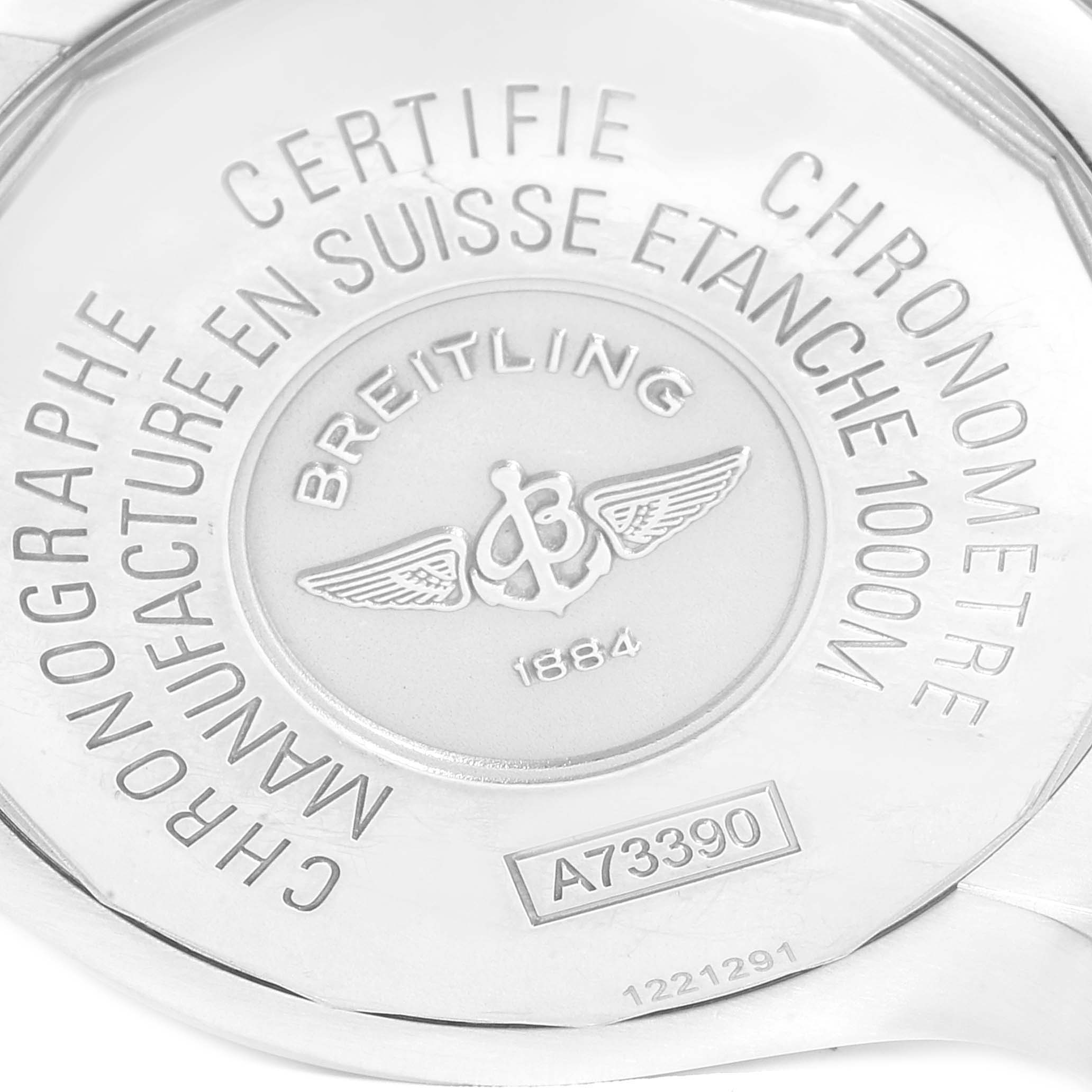 The image shows the back case of a Breitling Avenger A73390 Men
s Stainless Steel Silver Dial A73390 Men
s Stainless Steel Silver Dial watch, displaying its engravings and model number.