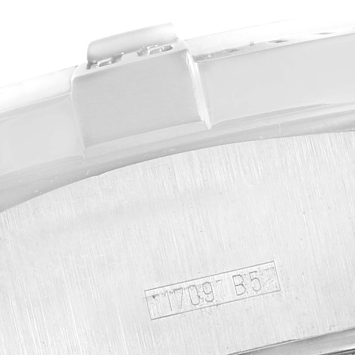 The image shows a close-up of the back or side part of a Breitling Avenger A73390 Men
s Stainless Steel Silver Dial A73390 Men
s Stainless Steel Silver Dial watch, highlighting its serial number.