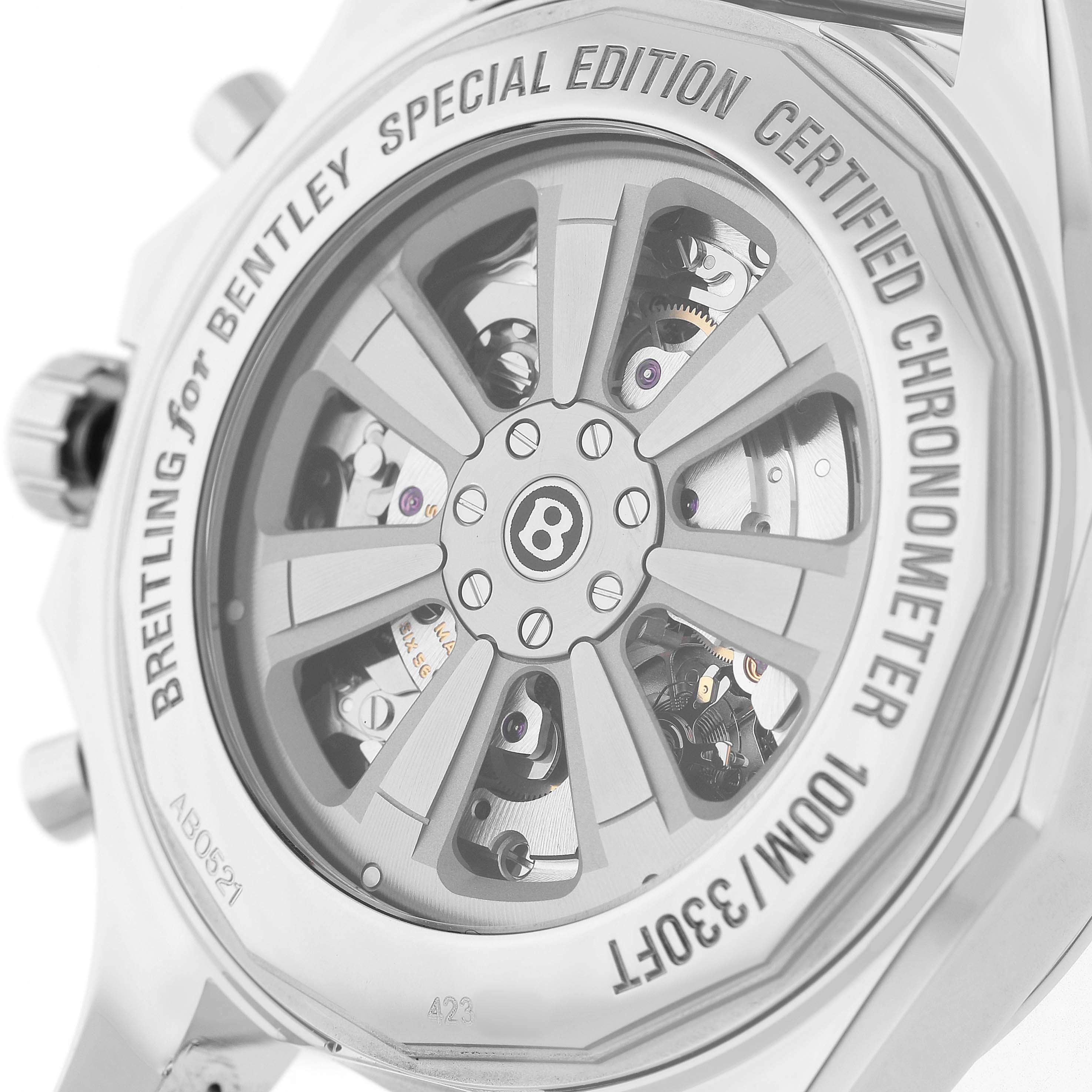 The image shows the back of the Breitling Bentley AB0521 Men's Stainless Steel Black Dial watch, highlighting the rotor and inner mechanisms.