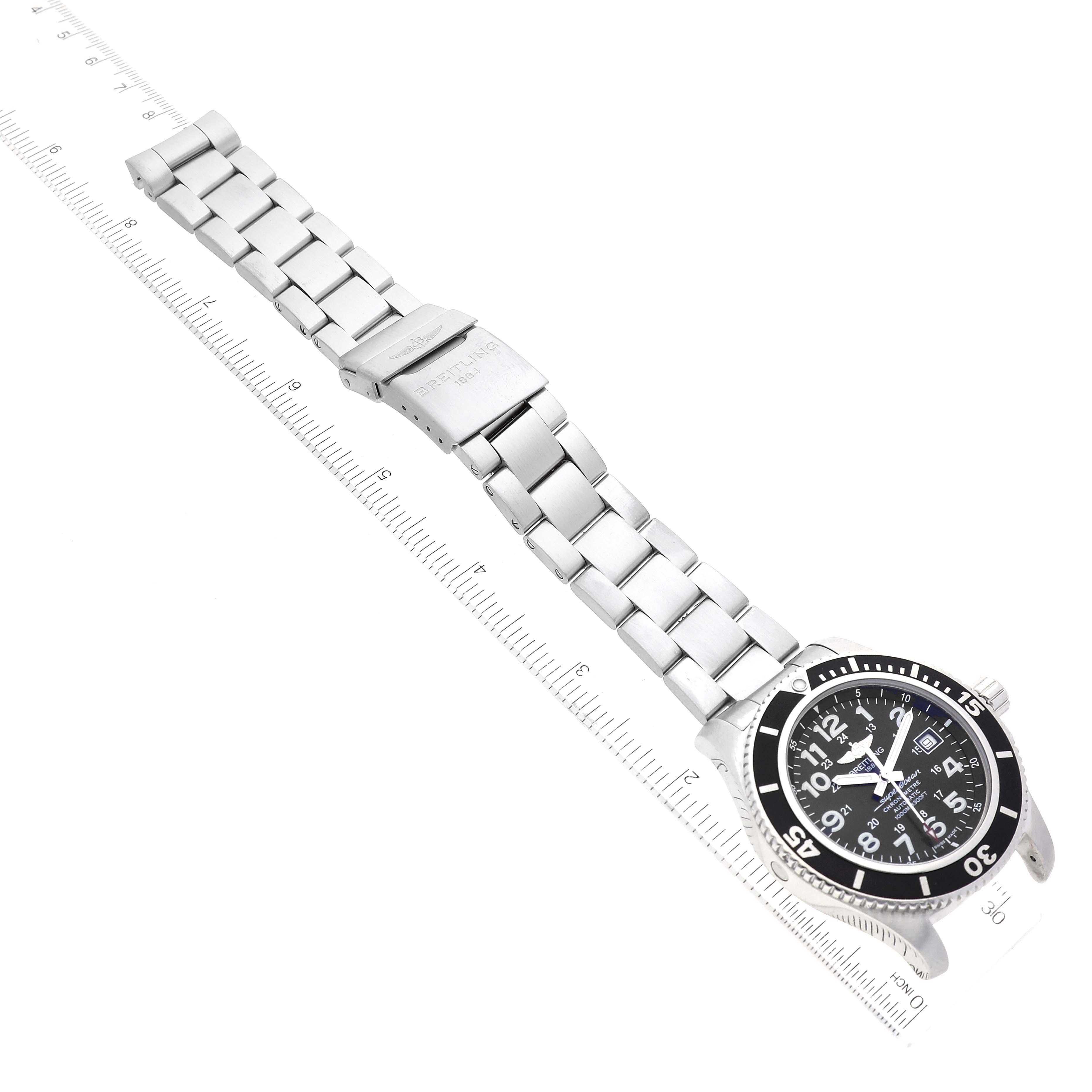 The image shows a side view of a Breitling Superocean A17392D8/C910 Men's Stainless Steel Black Dial A17392D8/C910 Men's Stainless Steel Black Dial watch, highlighting the metal bracelet and black bezel with numerical markings.