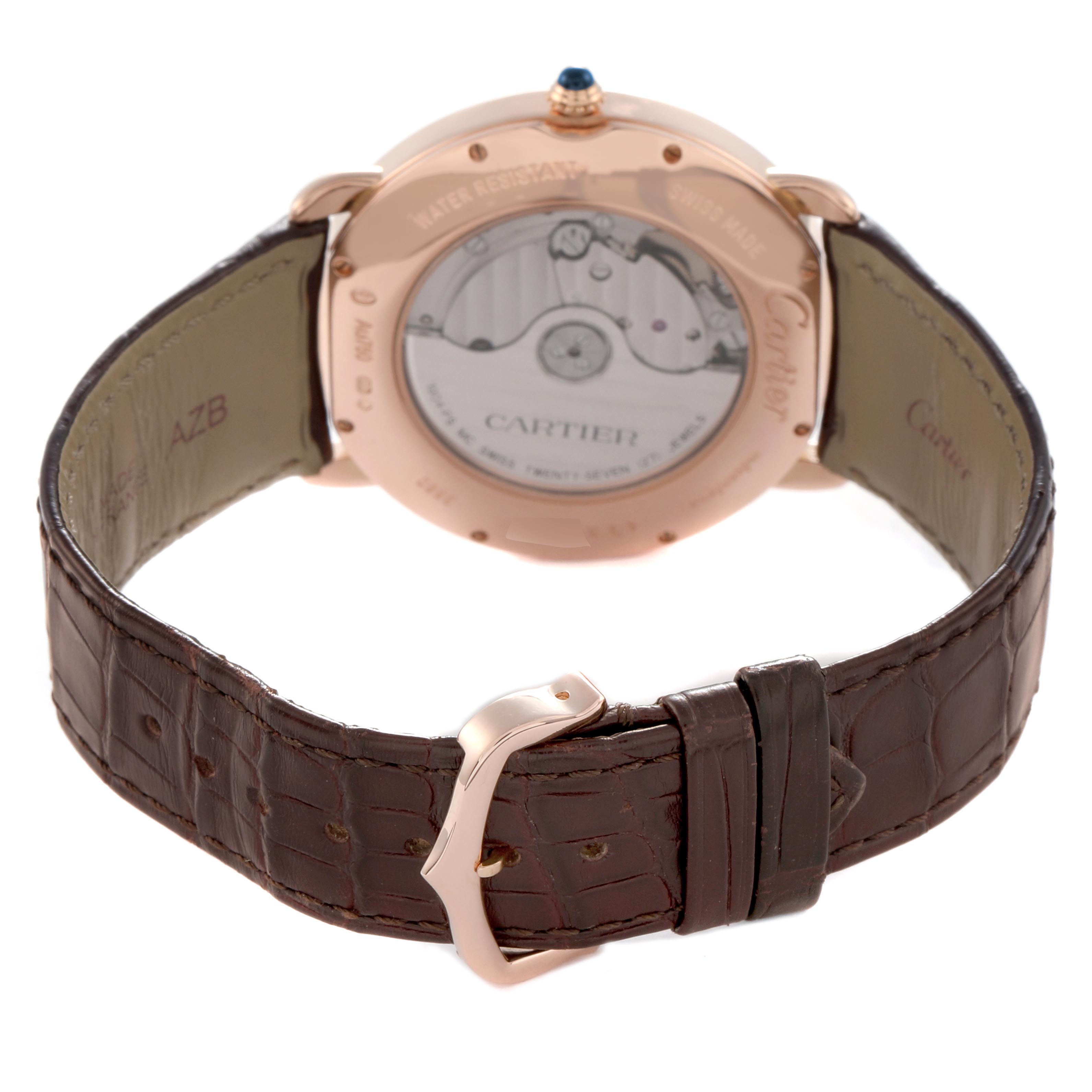 The Cartier Ronde W6801005 Men
s Rose Gold Silver Dial W6801005 Men
s Rose Gold Silver Dial watch is shown from the back, highlighting its transparent case back and brown leather strap with a metal buckle.
