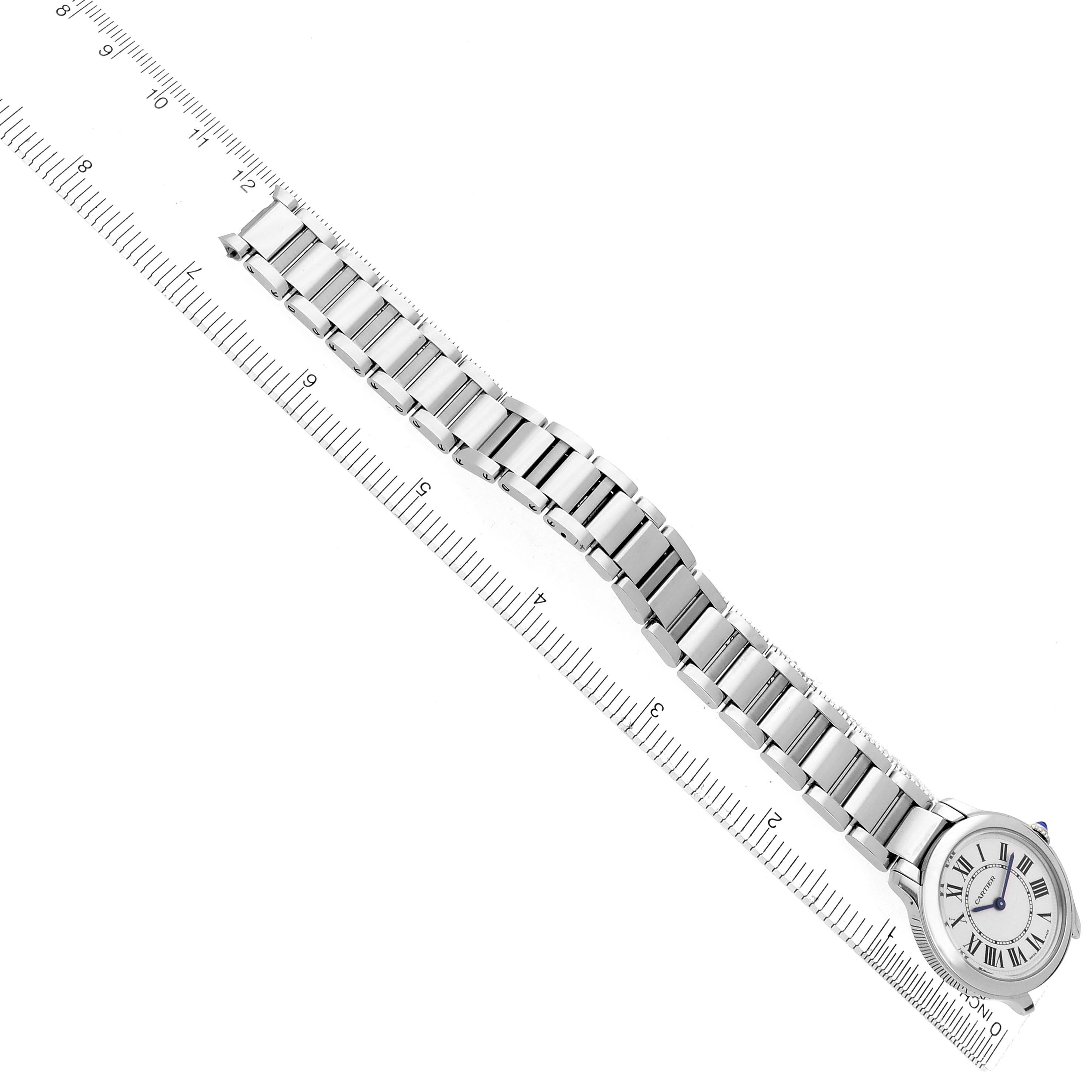 The Cartier Ronde WSRN0033 Women
s Stainless Steel Silver Dial WSRN0033 Women
s Stainless Steel Silver Dial watch is displayed diagonally, showing the face and full metal bracelet, alongside a ruler for scale.