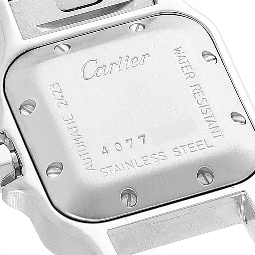 The image shows the back case of a Cartier Santos W20044D6 Women's Stainless Steel Silver Dial W20044D6 Women's Stainless Steel Silver Dial watch, displaying details like material, water resistance, and serial number.