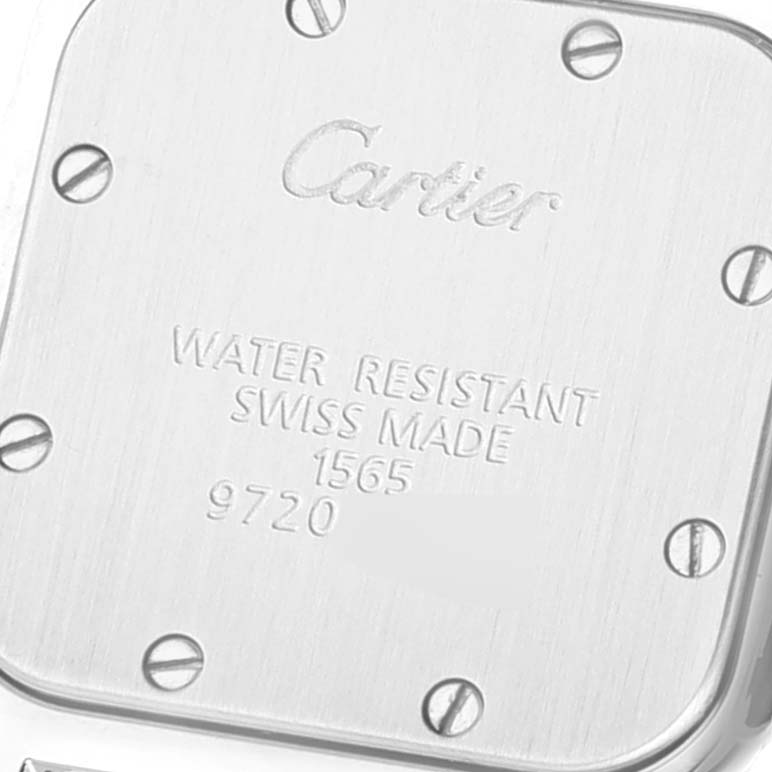 The image shows the back case of a Santos model watch by Cartier at a close-up angle.