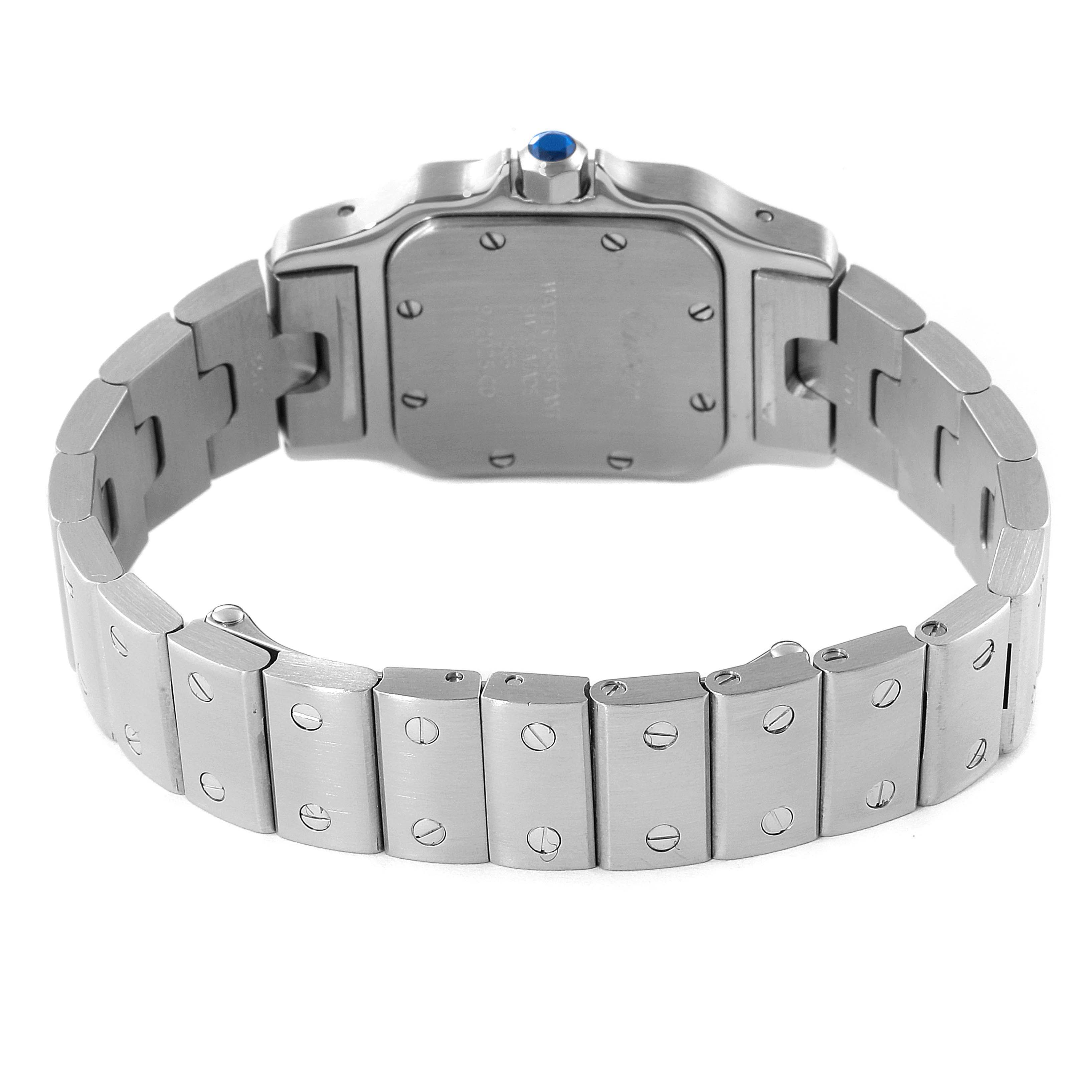 The image shows the underside of the Cartier Santos W20056D6 Women's Stainless Steel Silver Dial W20056D6 Women's Stainless Steel Silver Dial watch, highlighting the case back and metal bracelet.