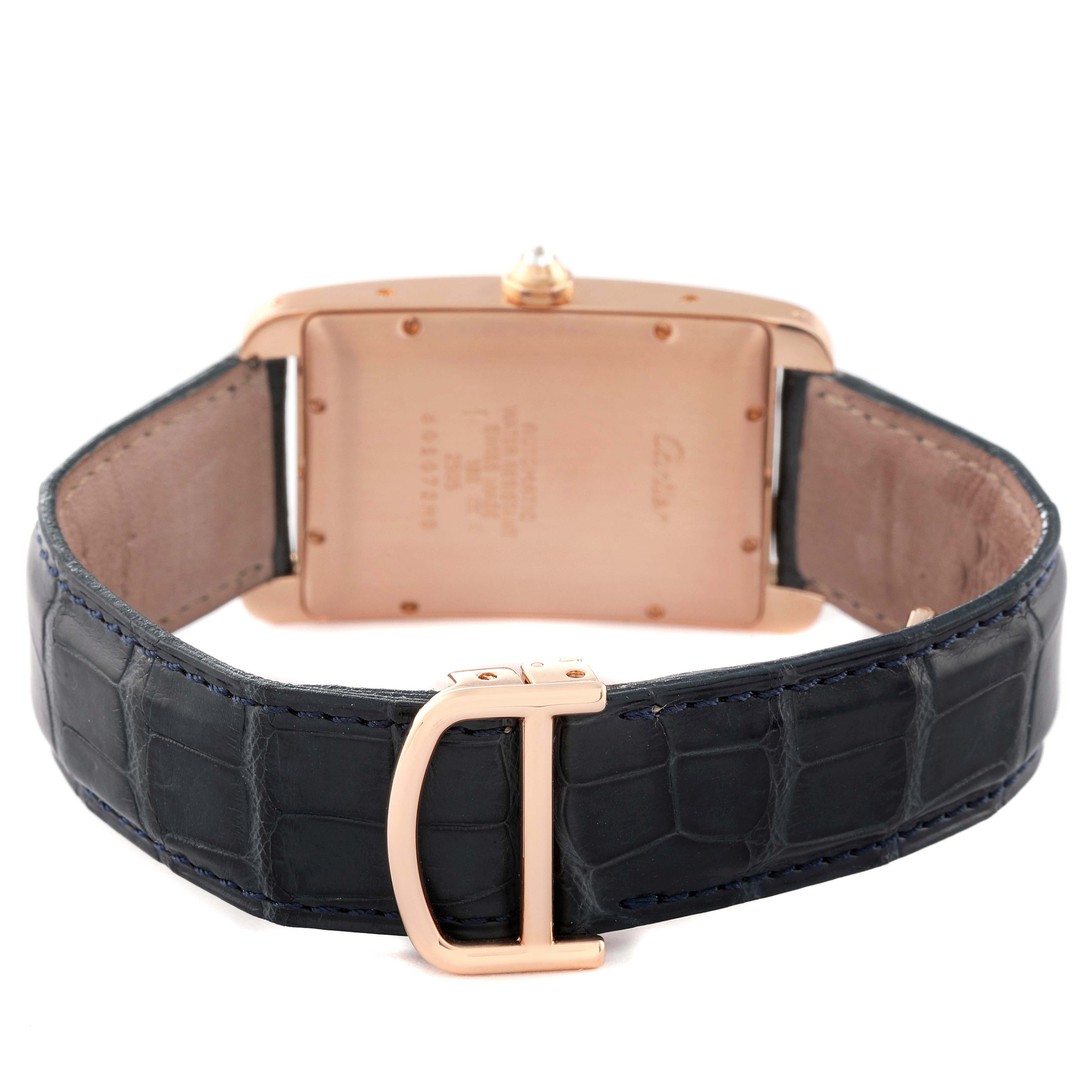 The image shows the back of a Cartier Tank Americaine WB704851 Men's Rose Gold Silver Dial WB704851 Men's Rose Gold Silver Dial watch with a focus on the leather strap and clasp.