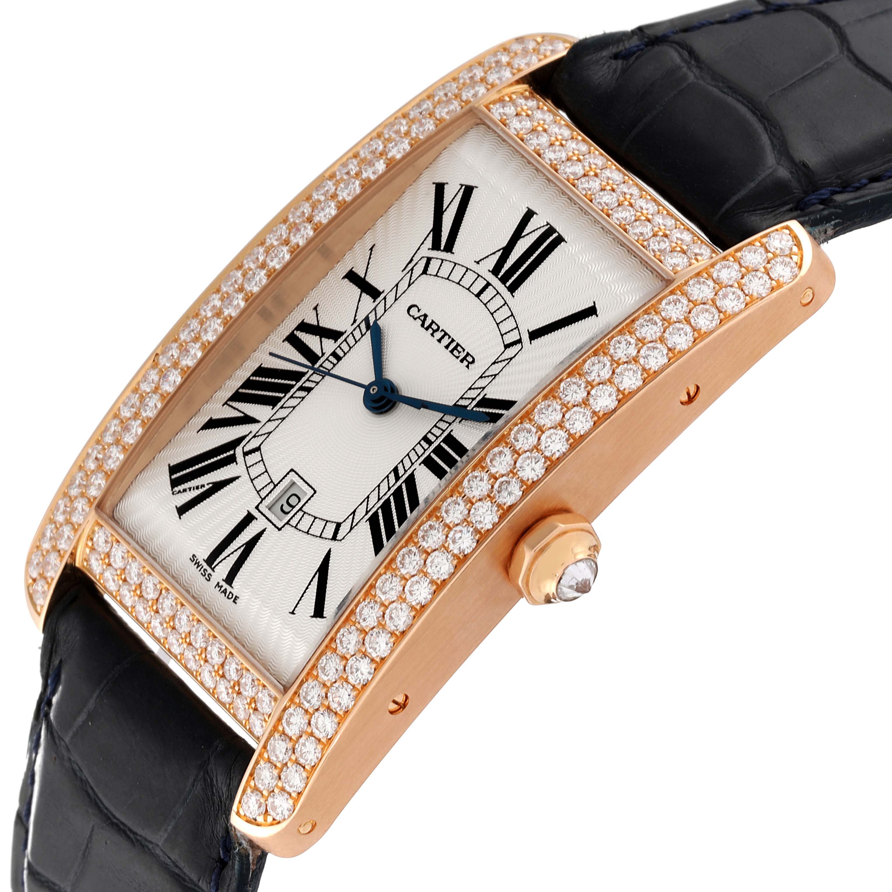 The image displays a Cartier Tank Americaine WB704851 Men's Rose Gold Silver Dial WB704851 Men's Rose Gold Silver Dial watch angled to show the face, diamond-set bezel, and the crown with a gem.