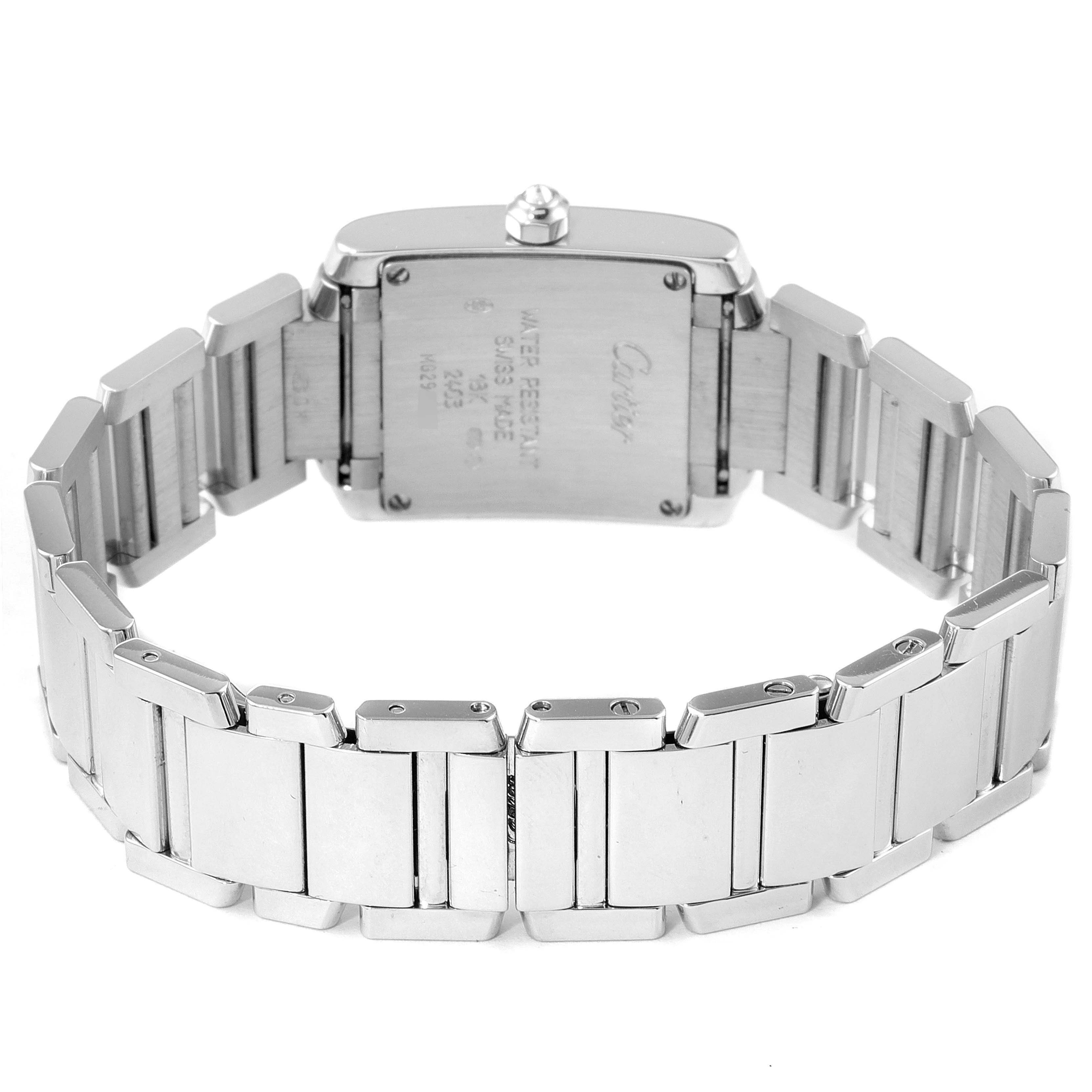 This image shows the back view of a Cartier Tank Française watch, highlighting its case back and stainless steel bracelet.