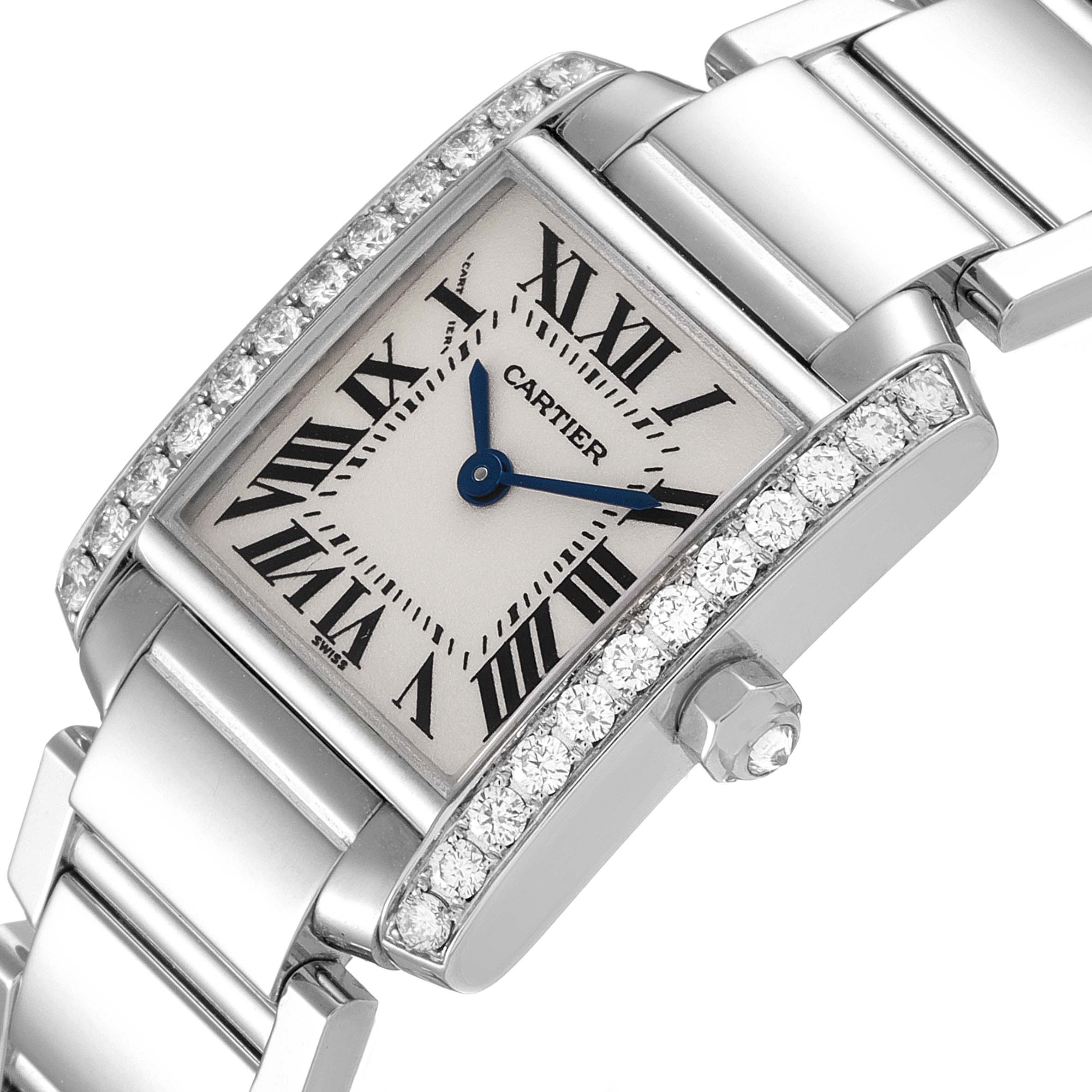 The image shows a Cartier Tank Francaise WE1002S3 Women's White Gold Silver Dial WE1002S3 Women's White Gold Silver Dial watch at an angle highlighting the face, partial bracelet, and diamond-encrusted bezel.