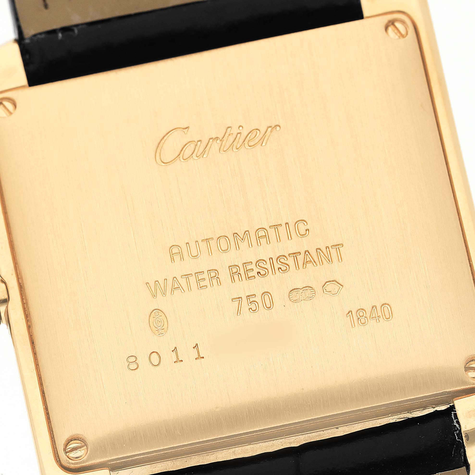 The image shows the back case of a Cartier Tank Francaise W5000156 Men's Yellow Gold Silver Dial watch at a close-up angle, displaying engravings and water-resistant details.