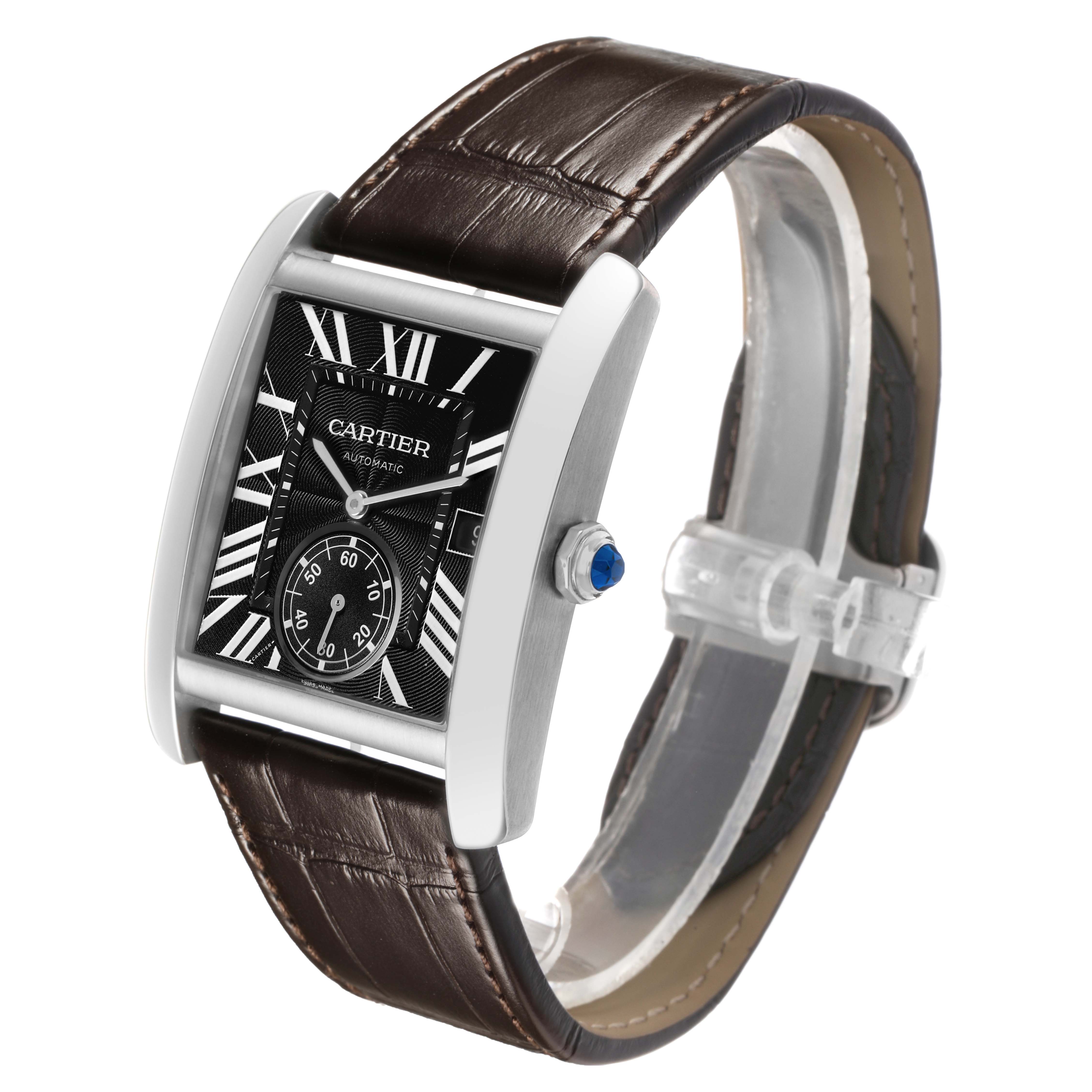 The Cartier Tank MC W5330003 Men's Stainless Steel Black Dial watch is shown at a tilted angle, highlighting its rectangular face, Roman numerals, and leather strap.