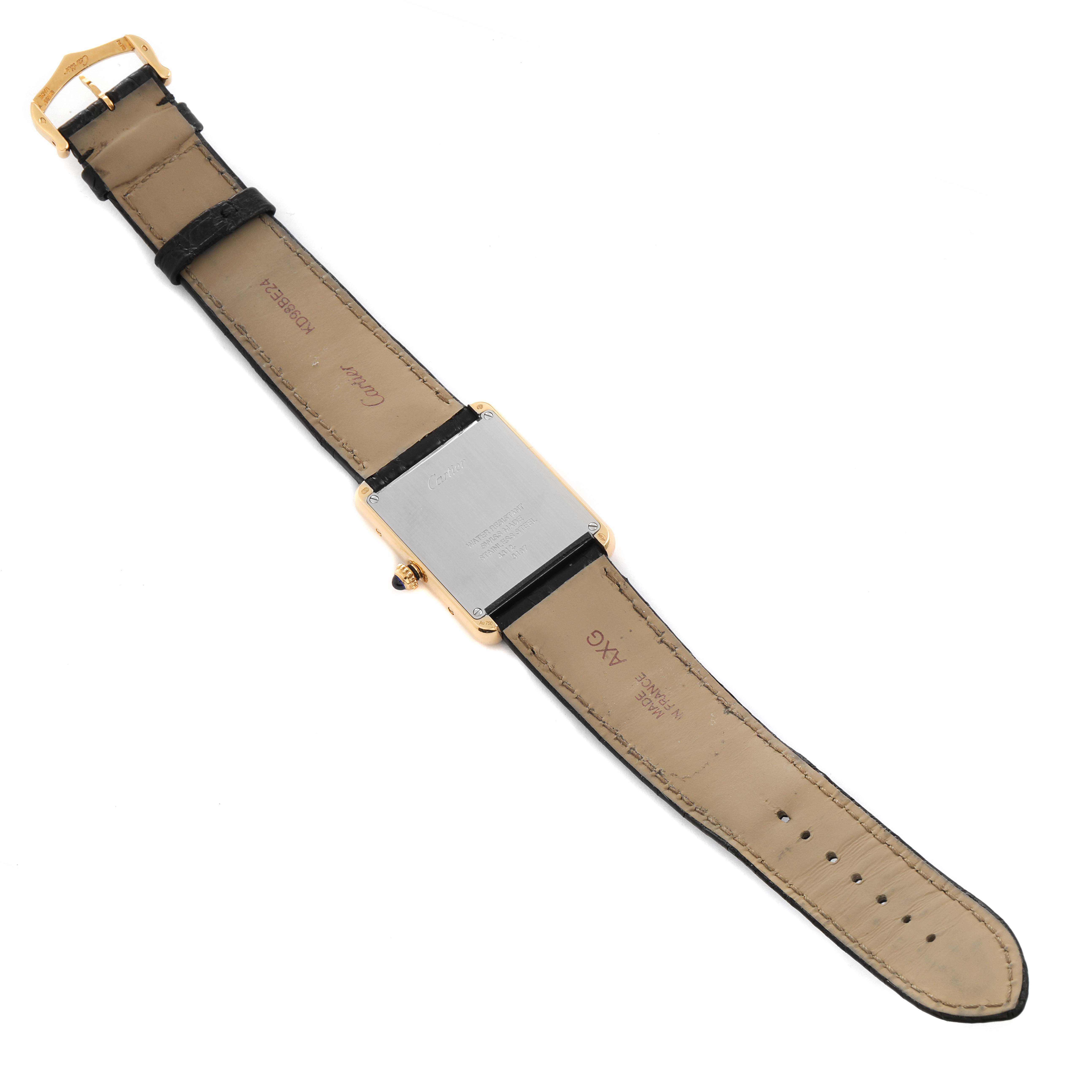 The image shows the back view of a Cartier Tank Solo W5200004 Men
s Yellow Gold Silver Dial W5200004 Men
s Yellow Gold Silver Dial watch, including its leather strap and clasp.