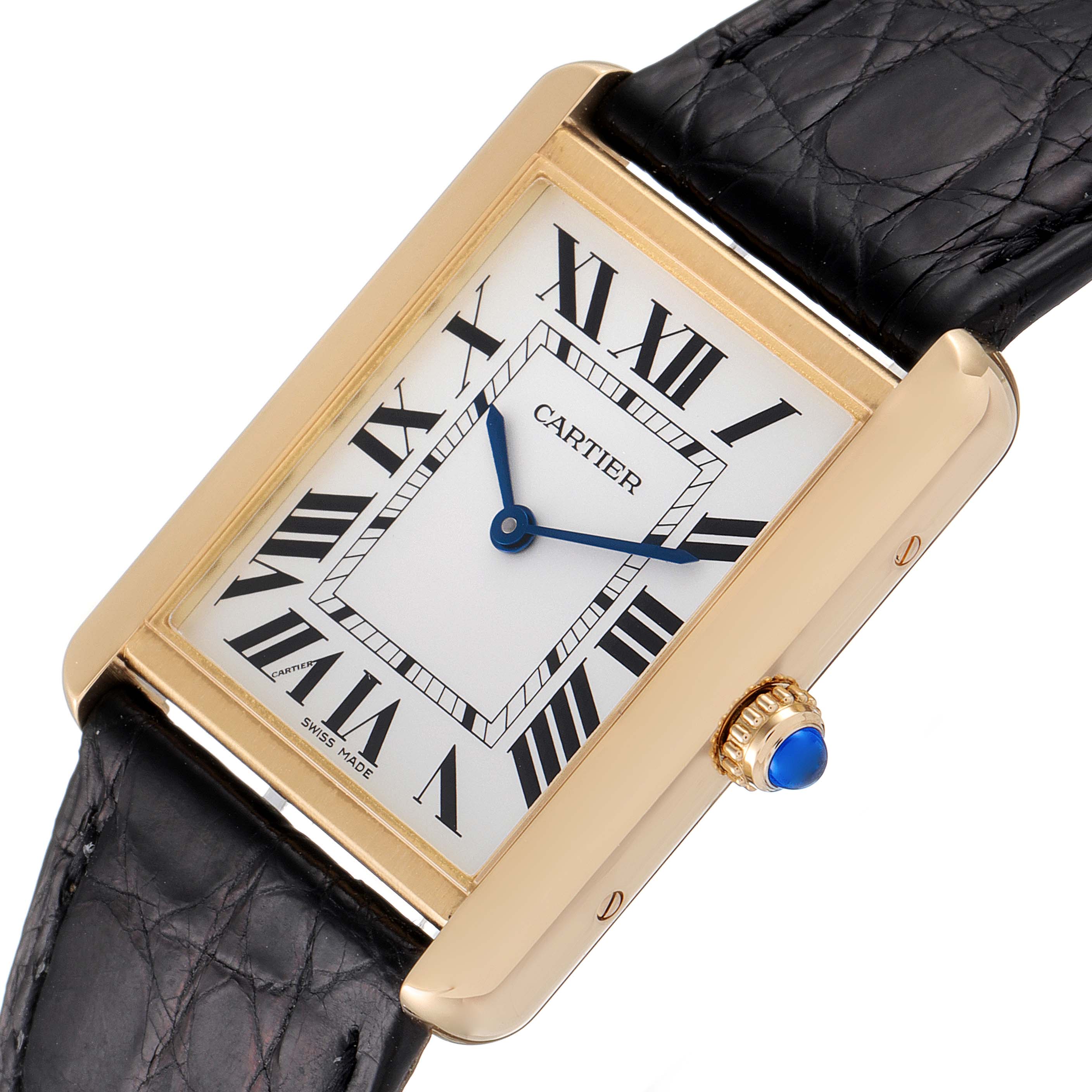 This image shows a Cartier Tank Solo W5200004 Men
s Yellow Gold Silver Dial W5200004 Men
s Yellow Gold Silver Dial watch with Roman numerals, blue hands, and a black leather strap from a close-up angle.