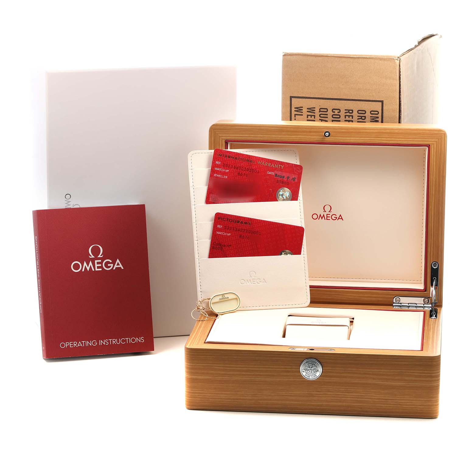 The image shows an Omega Aqua Terra 231.13.42.22.01.001 Men's Stainless Steel Black Dial watch box, instruction booklet, cards, and packaging viewed from the front.