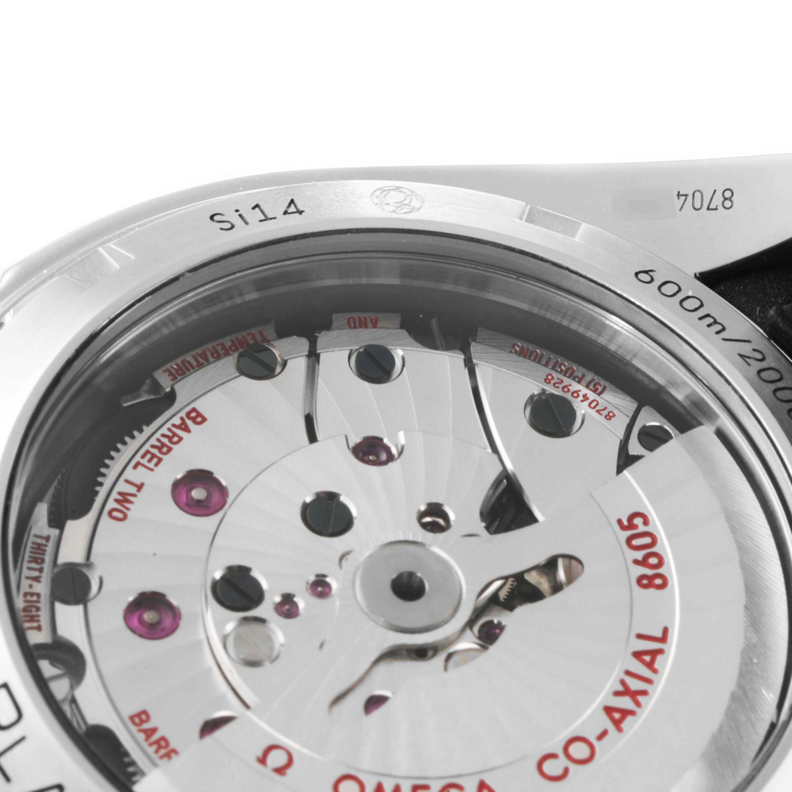 The image shows the back view of the Omega Planet Ocean 232.32.44.22.01.002 Men's Stainless Steel Black Dial 232.32.44.22.01.002 Men's Stainless Steel Black Dial watch, focusing on the exposed movement and inner components.