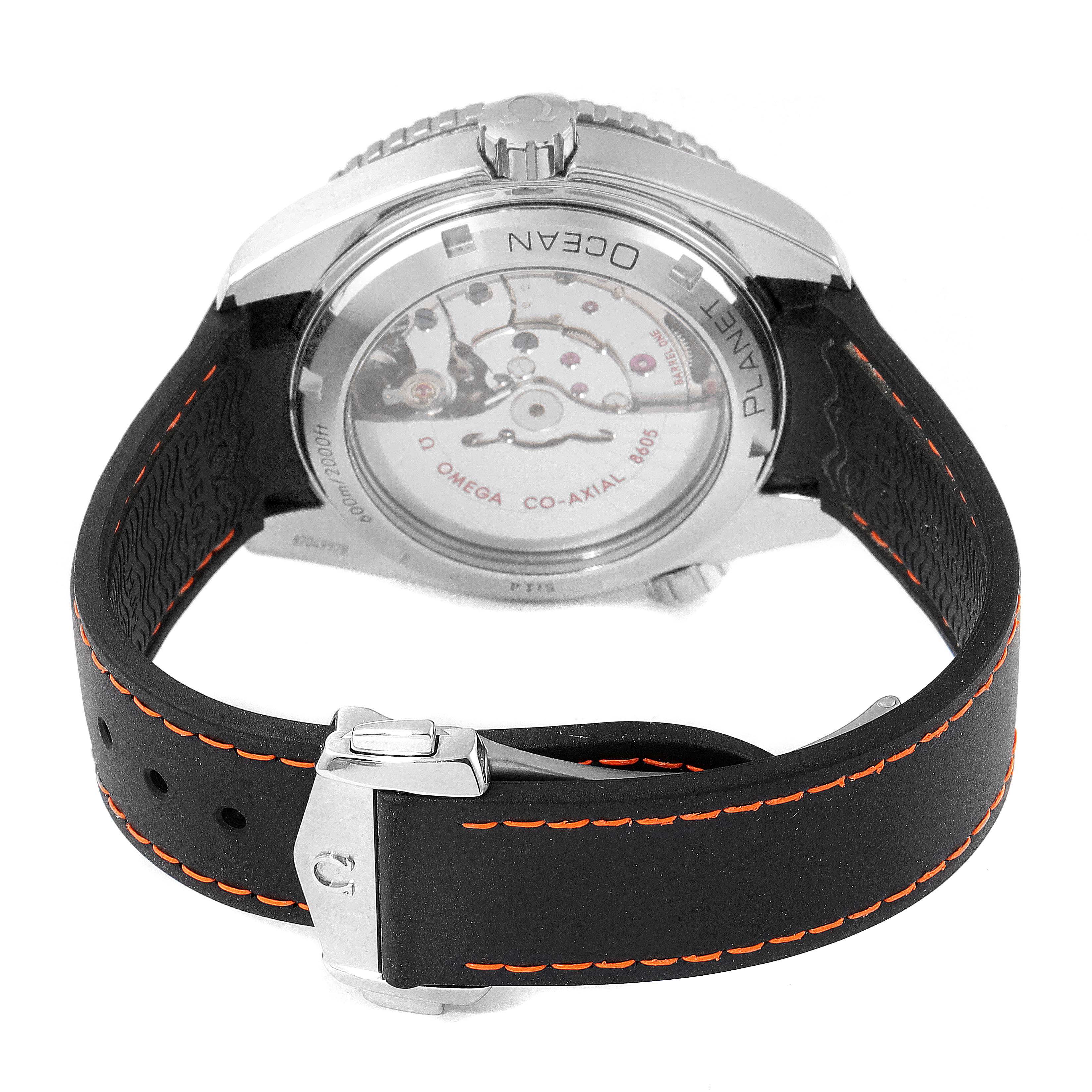 The image shows the back view of the Omega Planet Ocean 232.32.44.22.01.002 Men's Stainless Steel Black Dial 232.32.44.22.01.002 Men's Stainless Steel Black Dial watch, highlighting its case back and rubber strap with orange stitching.