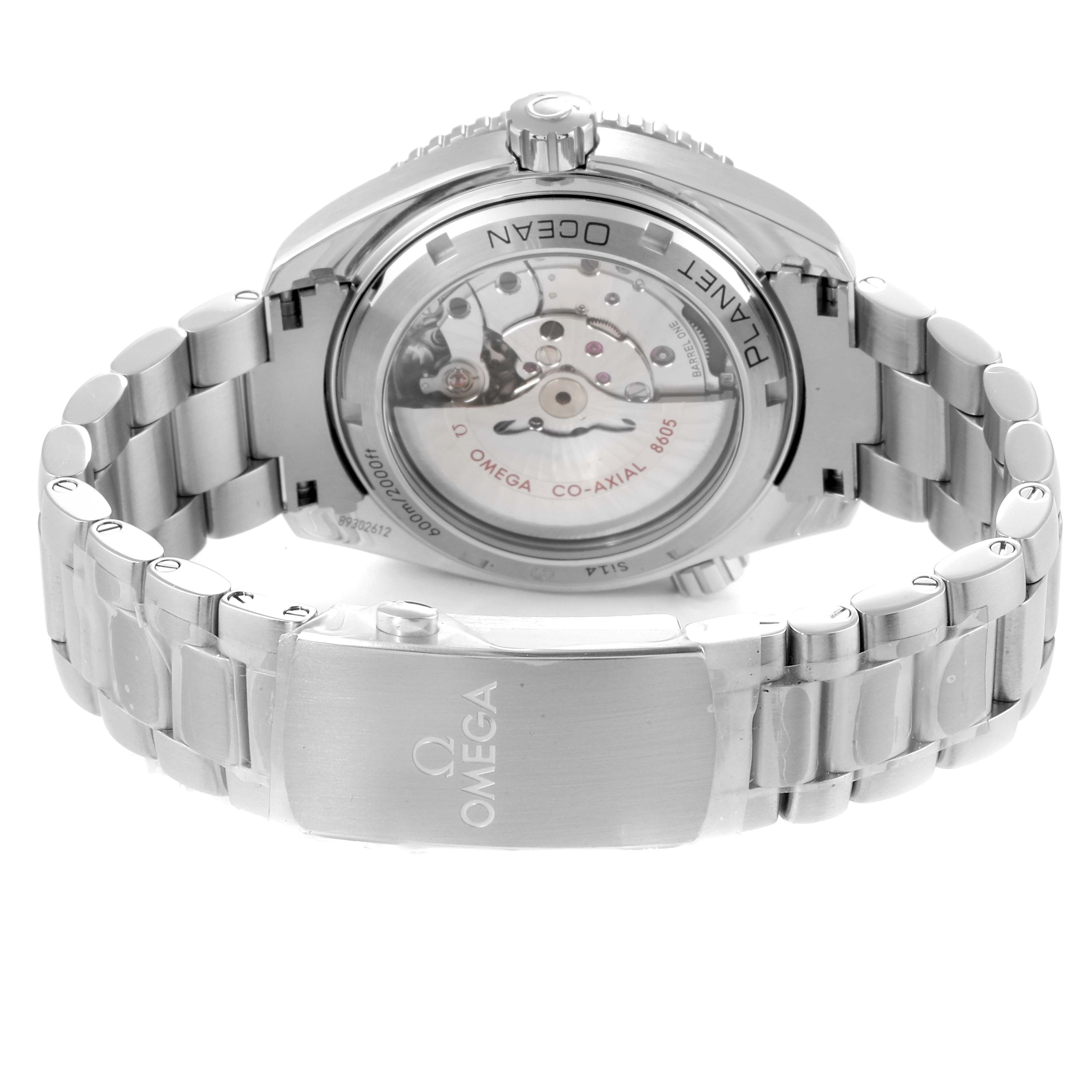 The image shows a rear view of the Omega Planet Ocean 232.30.44.22.01.001 Men
s Stainless Steel Black Dial 232.30.44.22.01.001 Men
s Stainless Steel Black Dial watch featuring its see-through case back and stainless-steel bracelet.