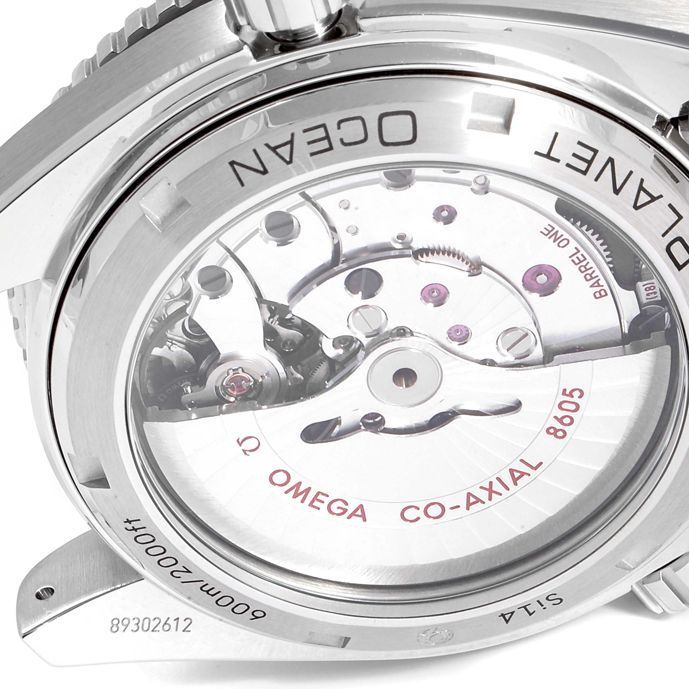 The image shows the back of the Omega Planet Ocean 232.30.44.22.01.001 Men
s Stainless Steel Black Dial 232.30.44.22.01.001 Men
s Stainless Steel Black Dial watch, highlighting its Co-Axial movement and visible mechanical components.