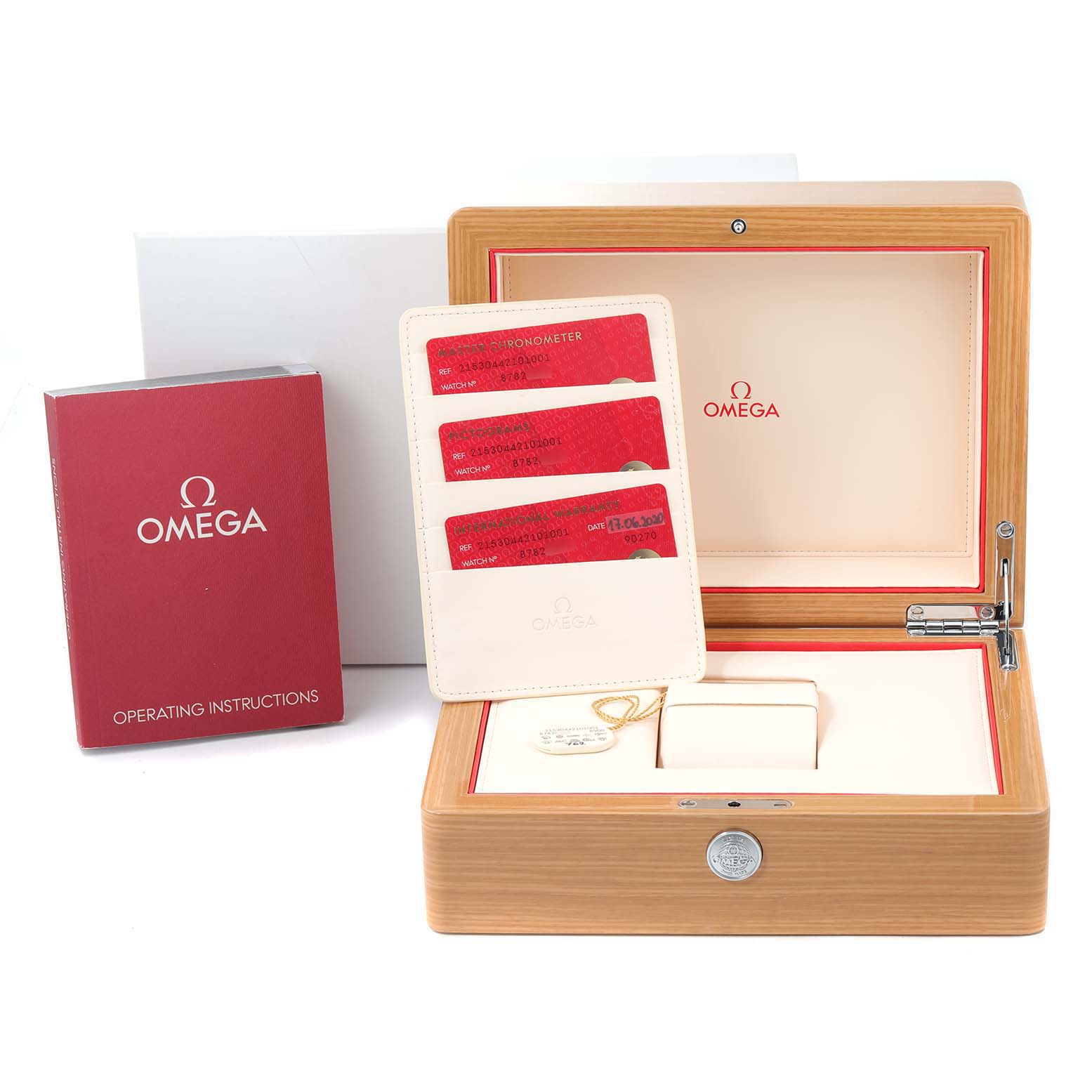 The image shows the packaging, warranty cards, and operating instructions for the Omega Planet Ocean 215.30.44.21.01.001 Men
s Stainless Steel Black Dial 215.30.44.21.01.001 Men
s Stainless Steel Black Dial model, with no watch visible.