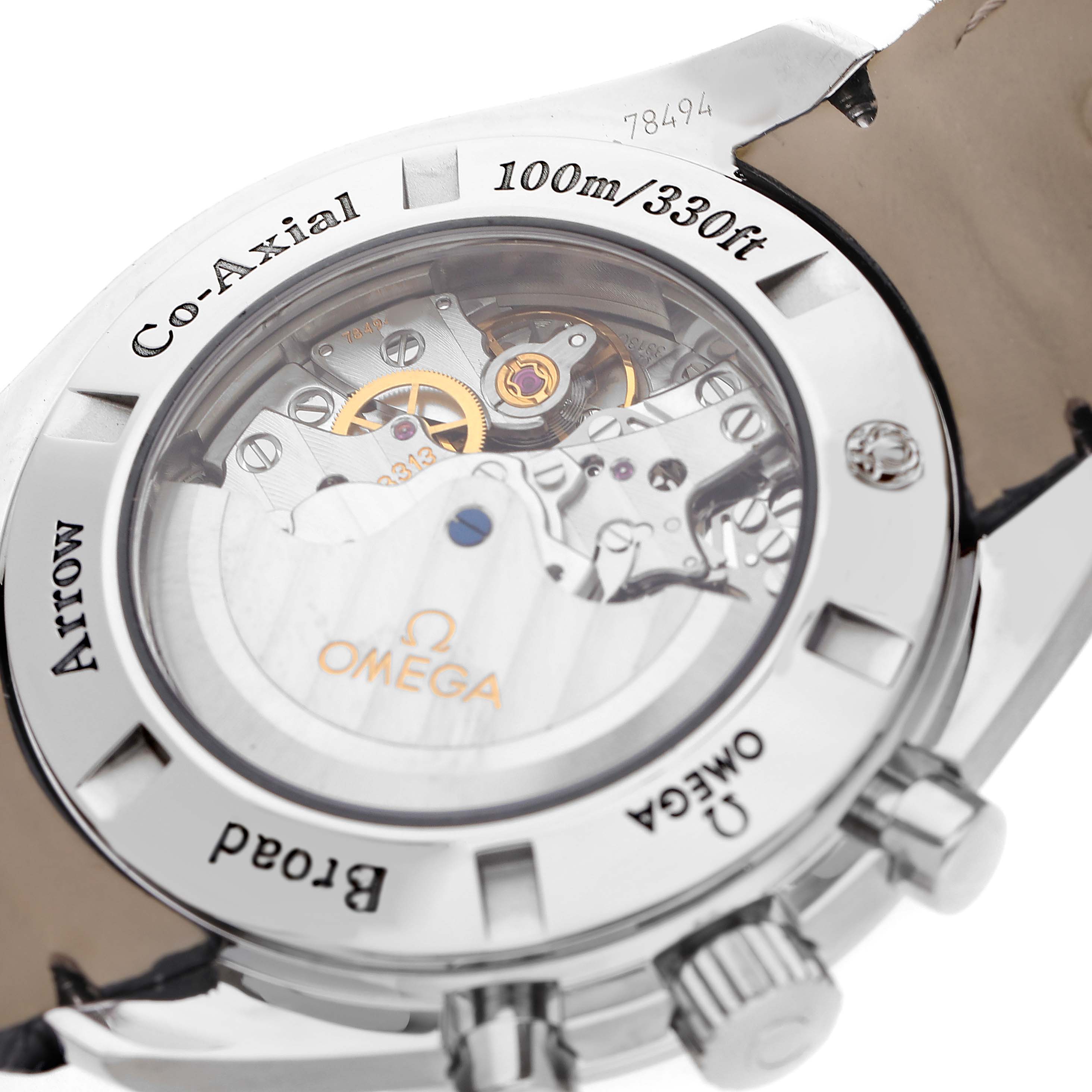The image shows the back of an Omega Speedmaster 321.13.44.50.02.001 Men's Stainless Steel Silver Dial, highlighting the co-axial movement and transparent case back.