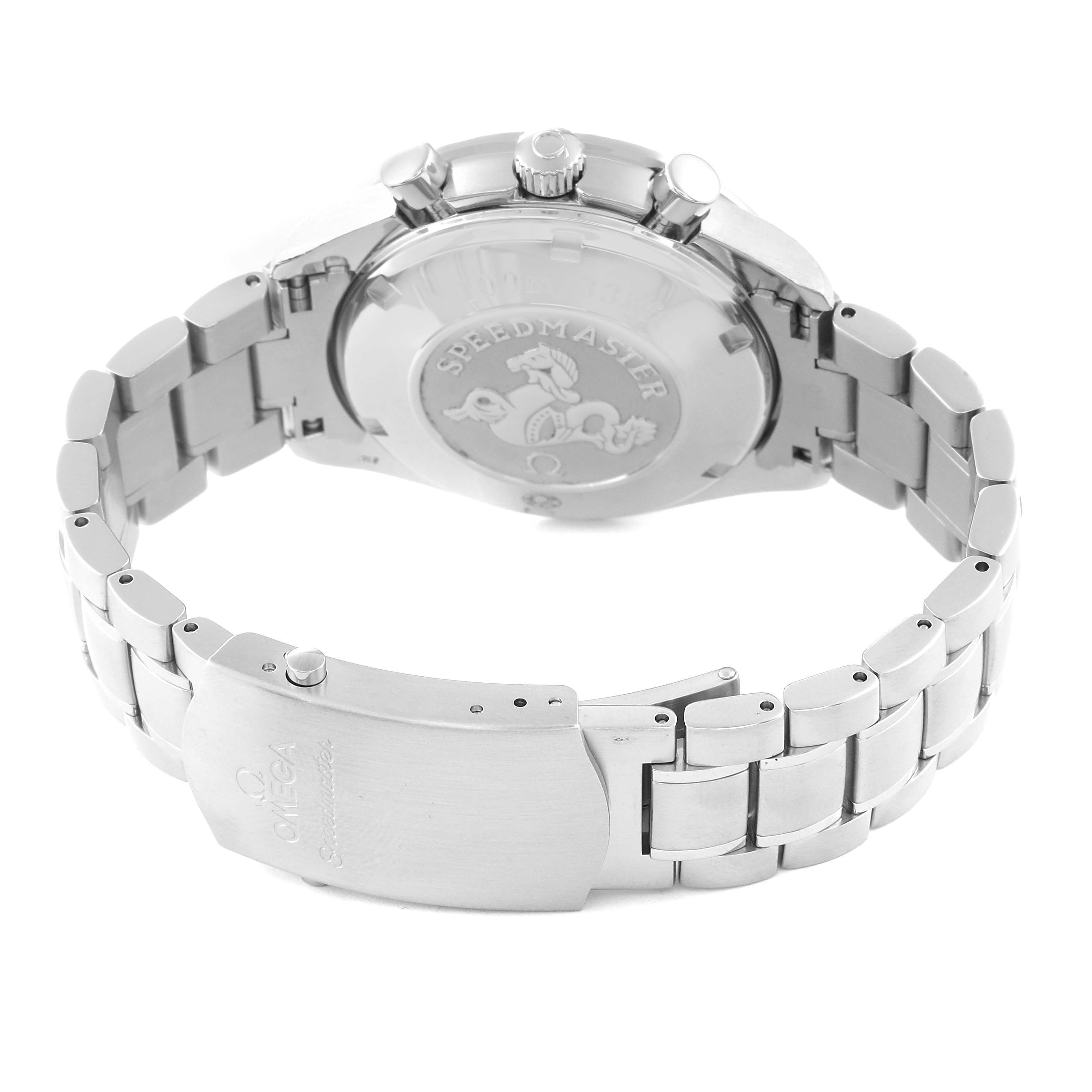 The image shows the back of an Omega Speedmaster 3220.50.00 Men
s Stainless Steel Black Dial 3220.50.00 Men
s Stainless Steel Black Dial watch, focusing on the case back and the metal bracelet with the clasp open.