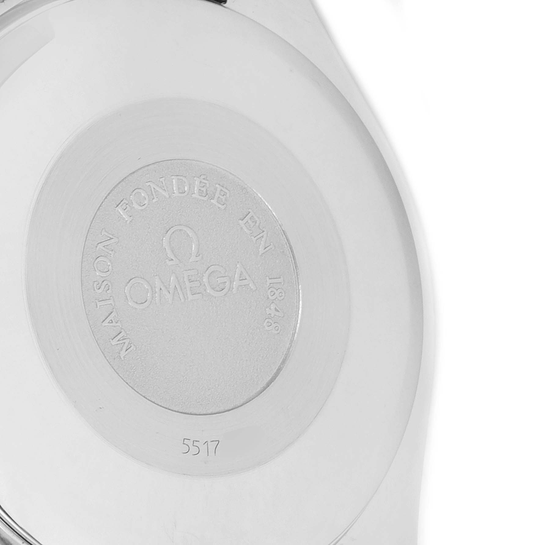 This image shows the case back of an Omega Speedmaster 3321.80.00 Men's Steel and Gold (two tone) Blue Dial 3321.80.00 Men's Steel and Gold (two tone) Blue Dial watch with engraved markings.