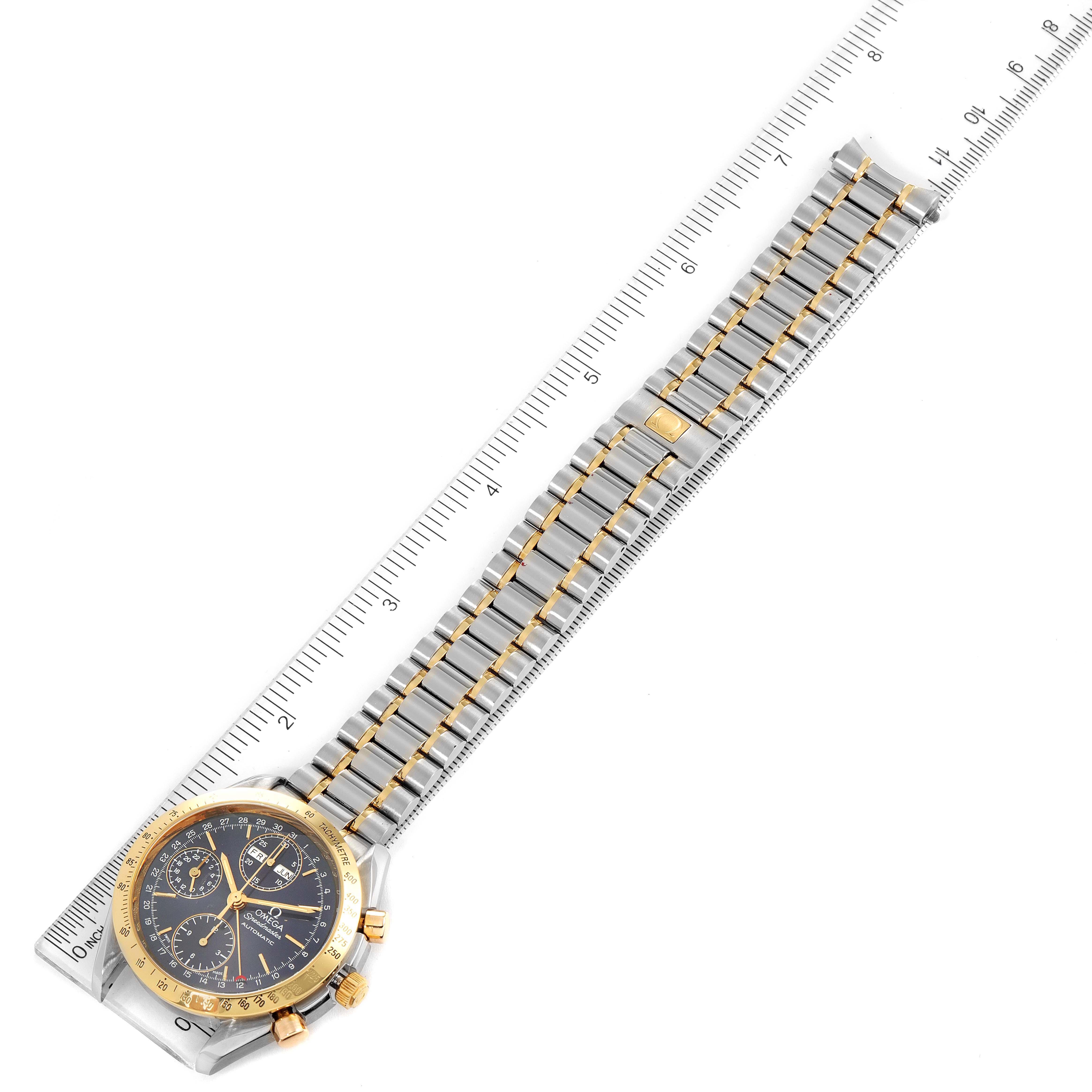 The image shows an Omega Speedmaster 3321.80.00 Men's Steel and Gold (two tone) Blue Dial 3321.80.00 Men's Steel and Gold (two tone) Blue Dial watch laid flat with a partial side angle, highlighting the face, bezel, and bracelet.
