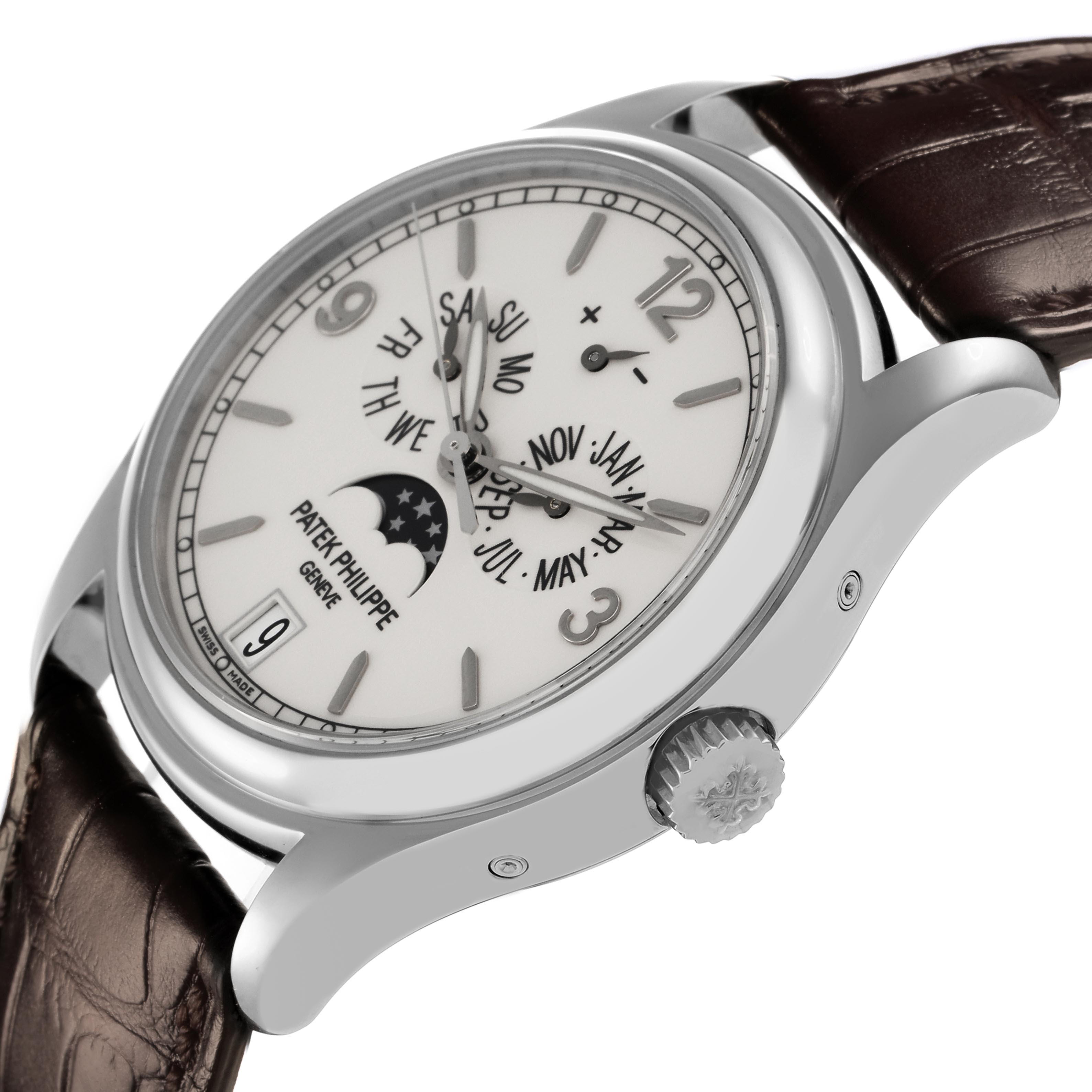 The Patek Philippe Complications 5146G Men's White Gold White Dial 5146G Men's White Gold White Dial watch is shown at an angled side view, displaying the dial, crown, and part of the strap.