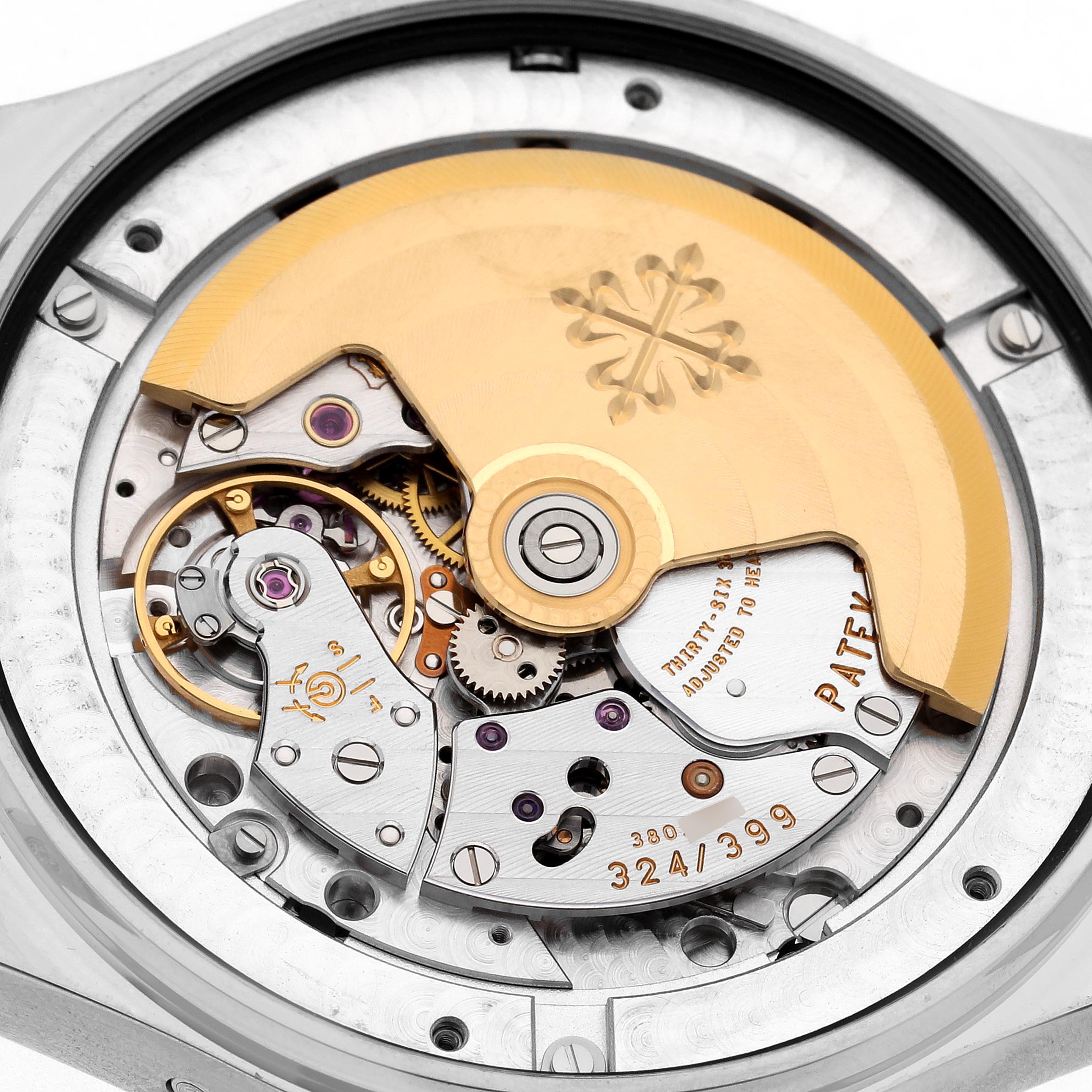 The Patek Philippe Complications 5146G Men's White Gold White Dial 5146G Men's White Gold White Dial model is shown from a caseback angle, highlighting its intricate movement and rotor.