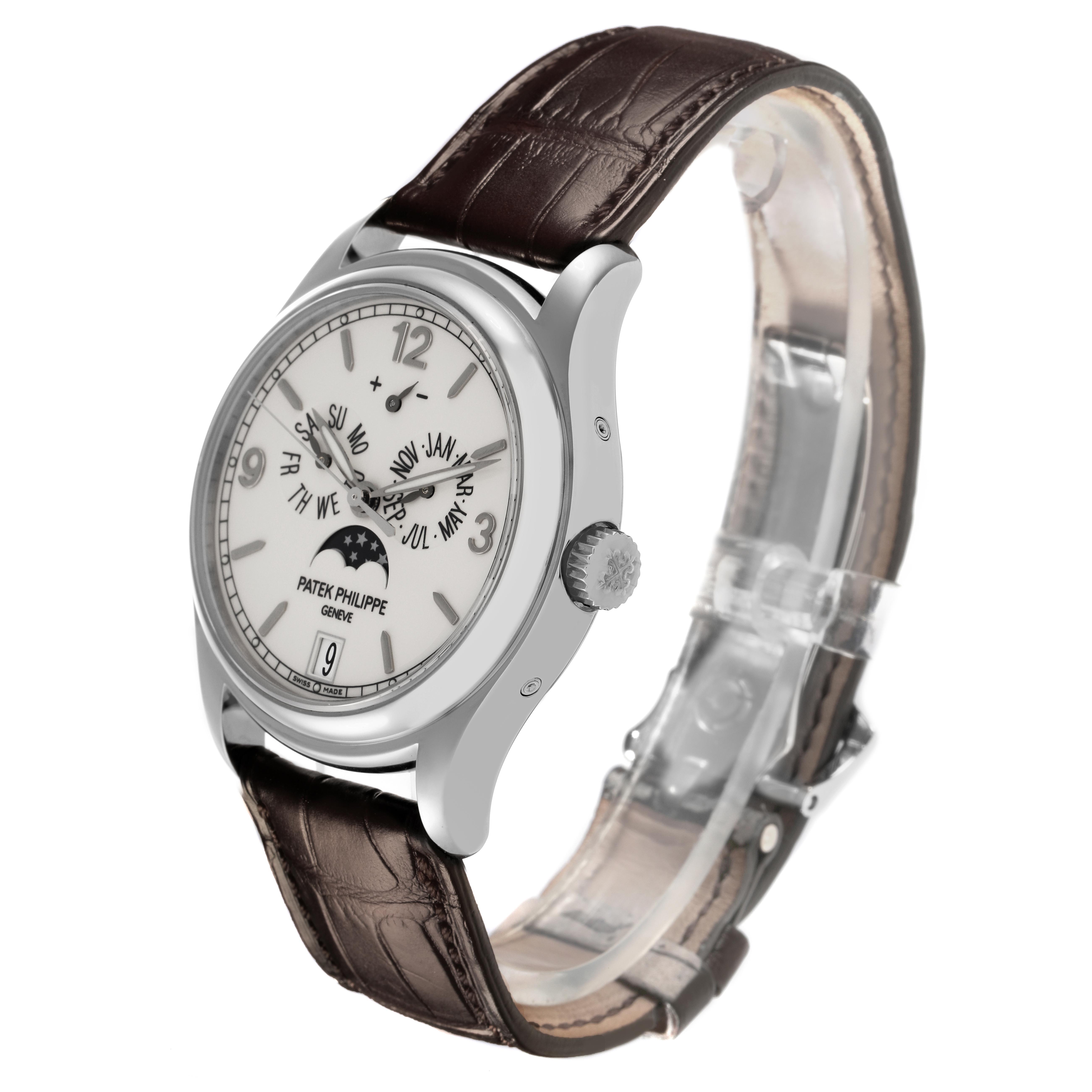 The Patek Philippe Complications 5146G Men's White Gold White Dial 5146G Men's White Gold White Dial watch is displayed at a three-quarter angle, showing the dial, case, crown, and strap.