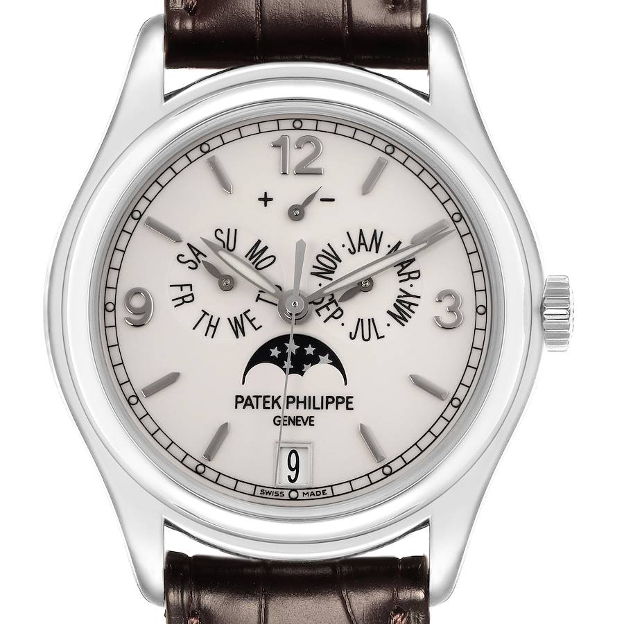 The Patek Philippe Complications watch is shown from the front, displaying its face, dial, crown, and leather strap.