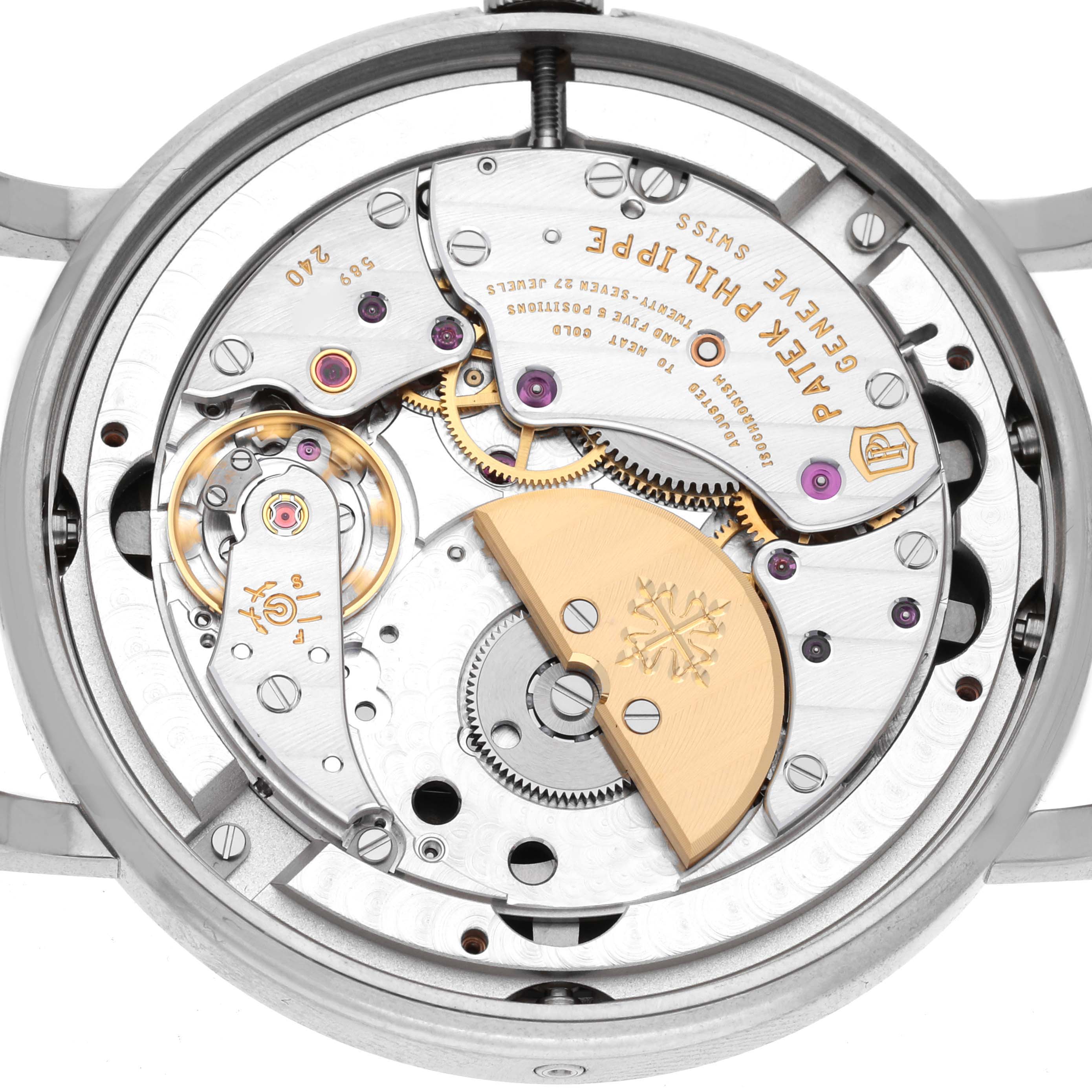 The image shows the movement of a Patek Philippe Complications 5139G Men's White Gold Black Dial 5139G Men's White Gold Black Dial watch from the back, highlighting gears and the rotor.