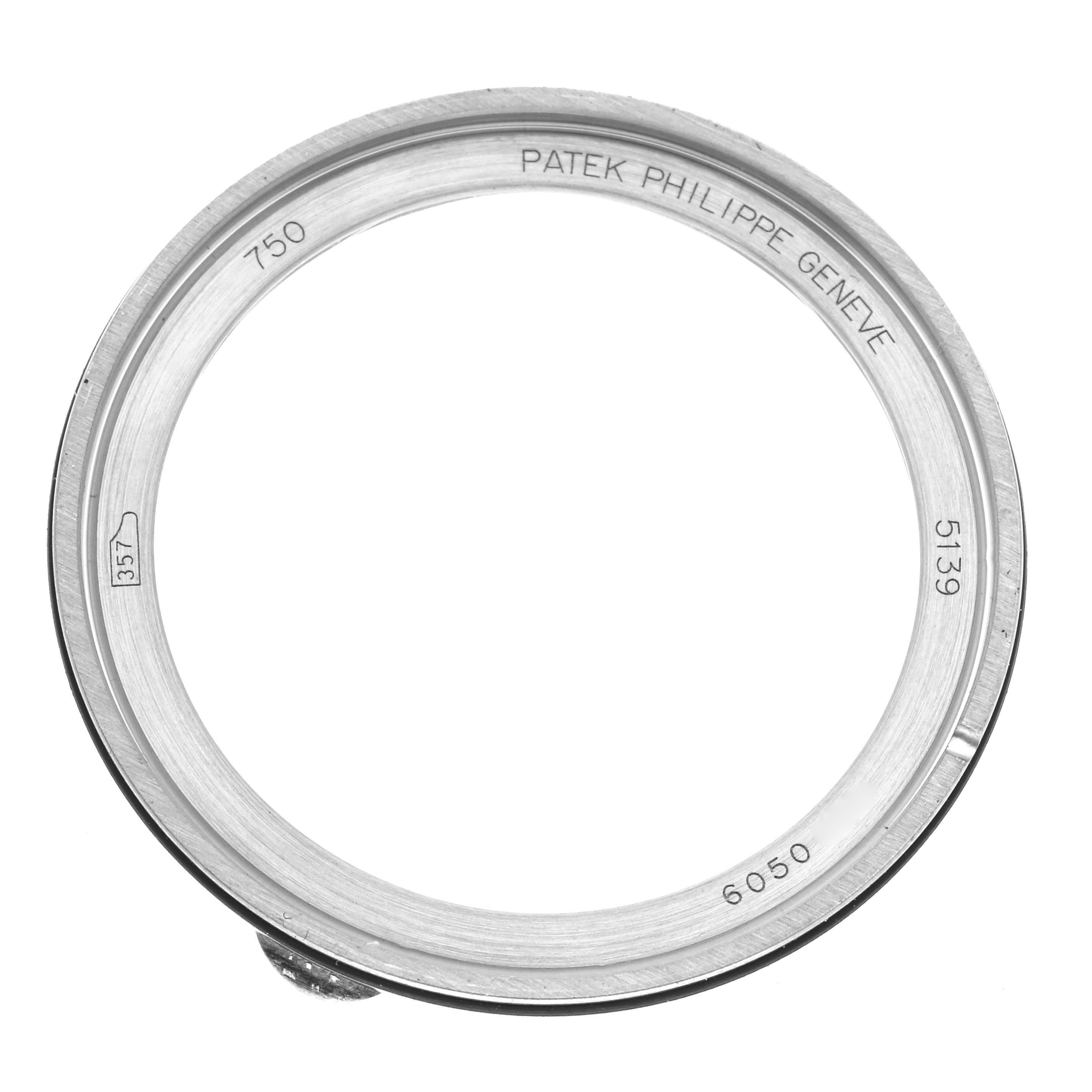 The image shows the bezel of a Patek Philippe Complications 5139G Men's White Gold Black Dial 5139G Men's White Gold Black Dial watch, viewed from the top.