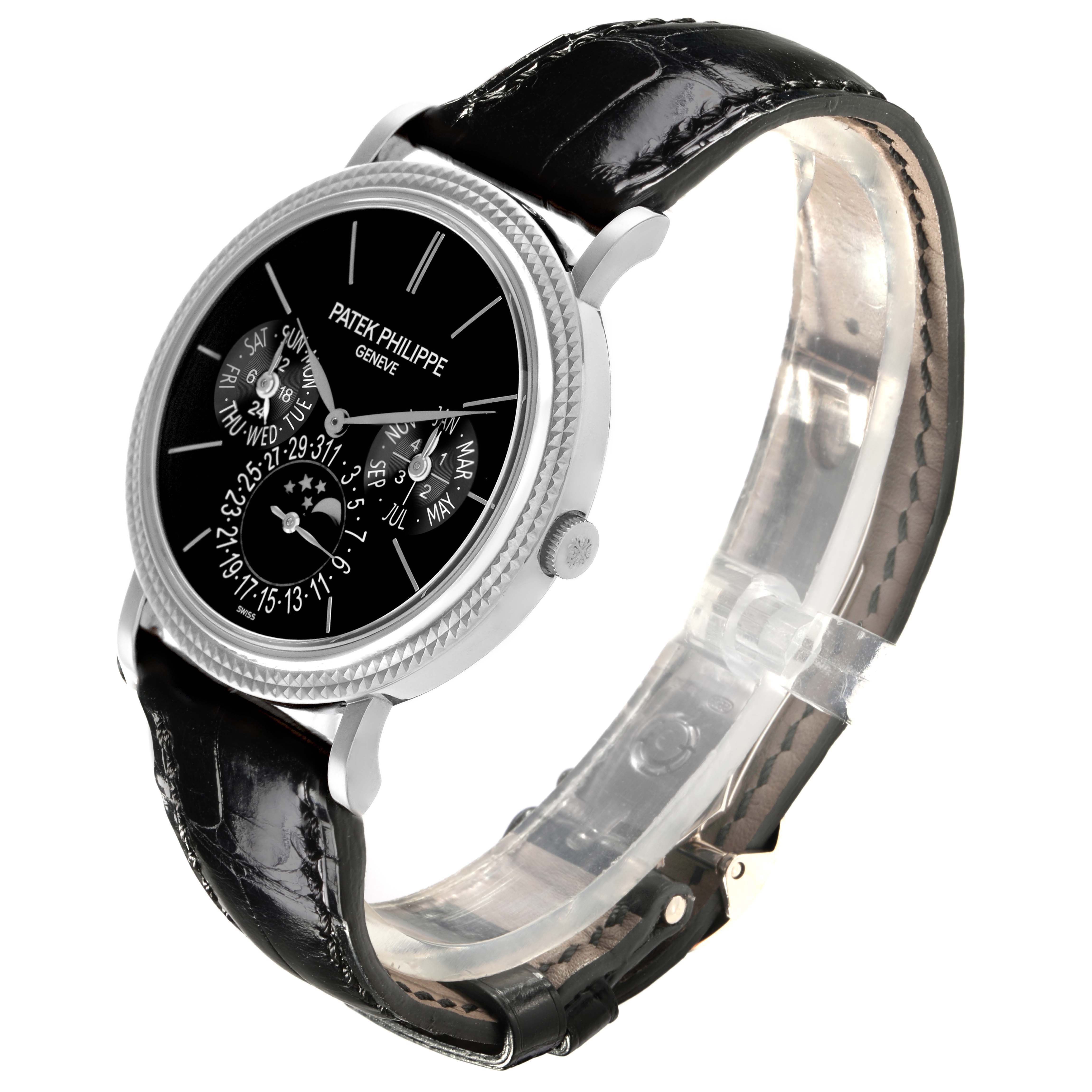 The Patek Philippe Complications 5139G Men's White Gold Black Dial 5139G Men's White Gold Black Dial watch is shown at a three-quarter angle, highlighting the black dial, subdials, and leather strap.