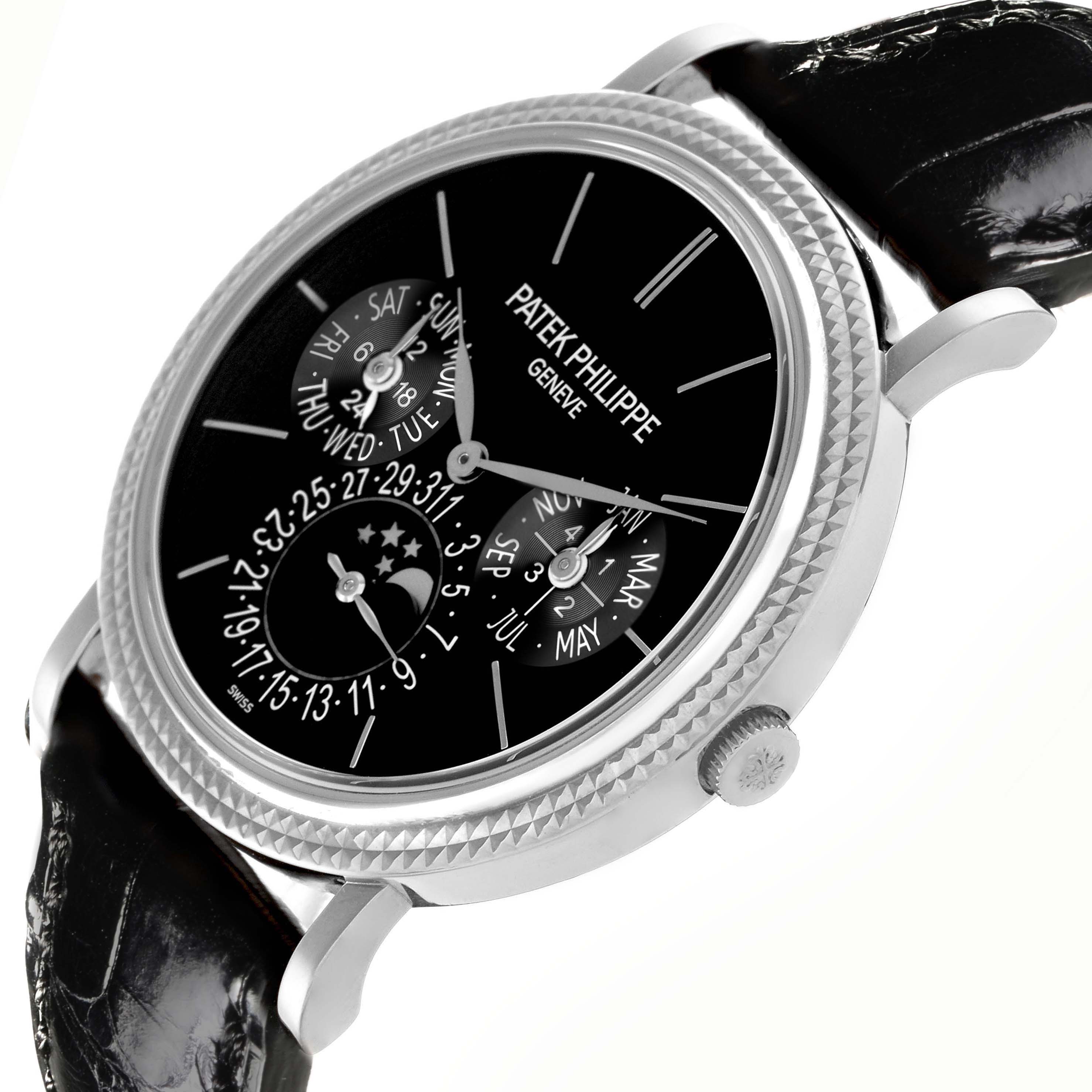 The Patek Philippe Complications 5139G Men's White Gold Black Dial 5139G Men's White Gold Black Dial watch is viewed at an angle, showing the dial, subdials, case, crown, and leather strap.