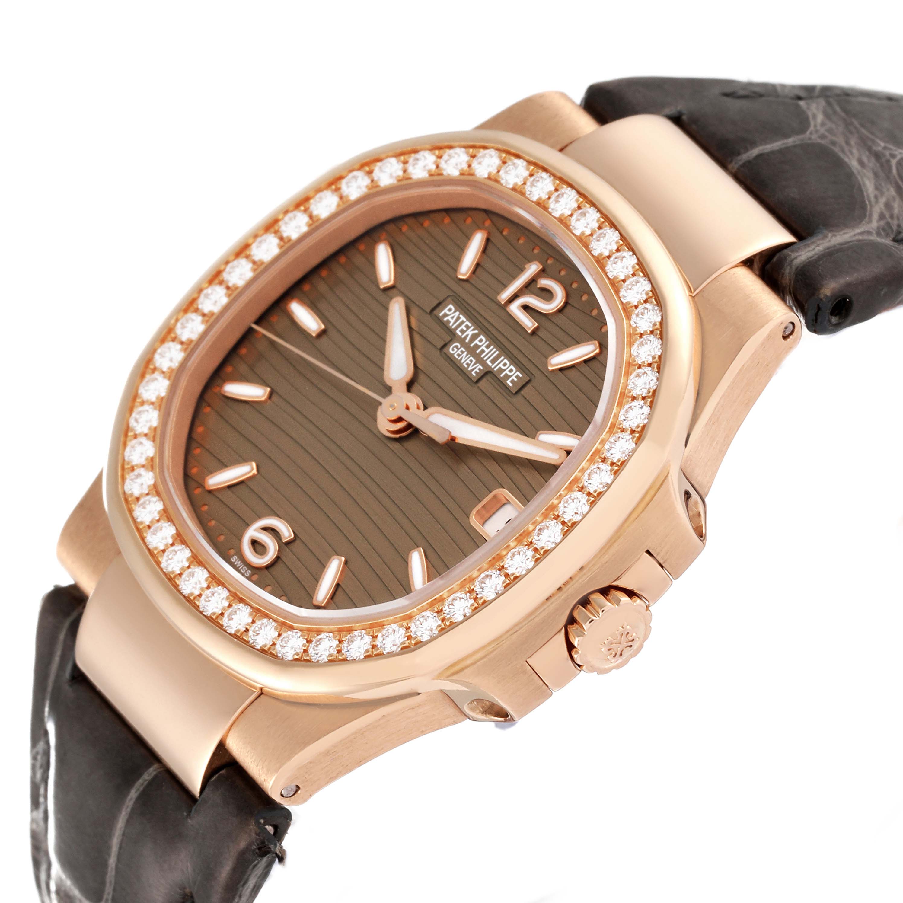 The image shows a Patek Philippe Nautilus 7010R-012 Women's Rose Gold Champagne Dial 7010R-012 Women's Rose Gold Champagne Dial watch at an angle, highlighting its diamond bezel, dial, crown, and strap.