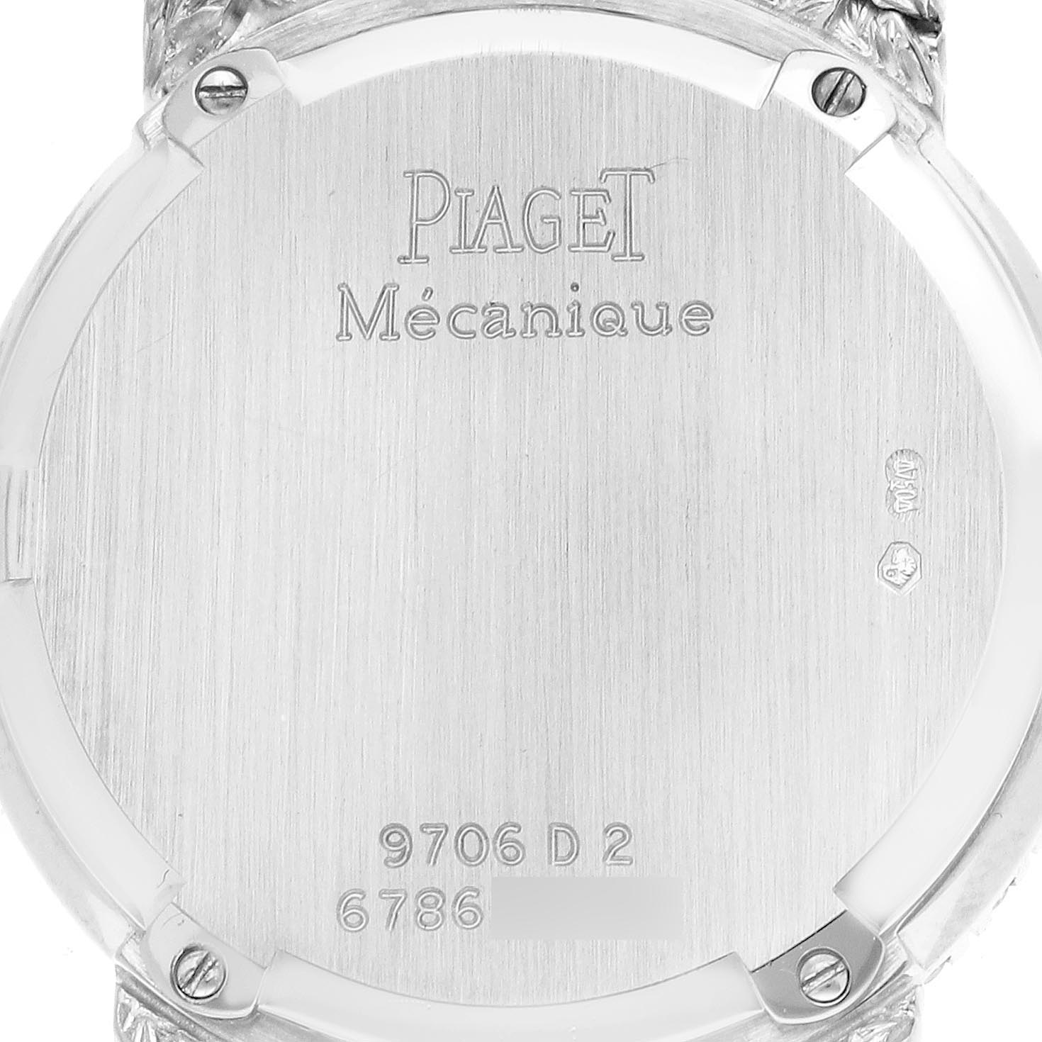 The image shows the back case of a Piaget 9706D2 Women
s White Gold Silver Dial 9706D2 Women
s White Gold Silver Dial Tradition White Gold Diamond Sapphire Ladies Watch 9706D2, displaying engravings and screws.